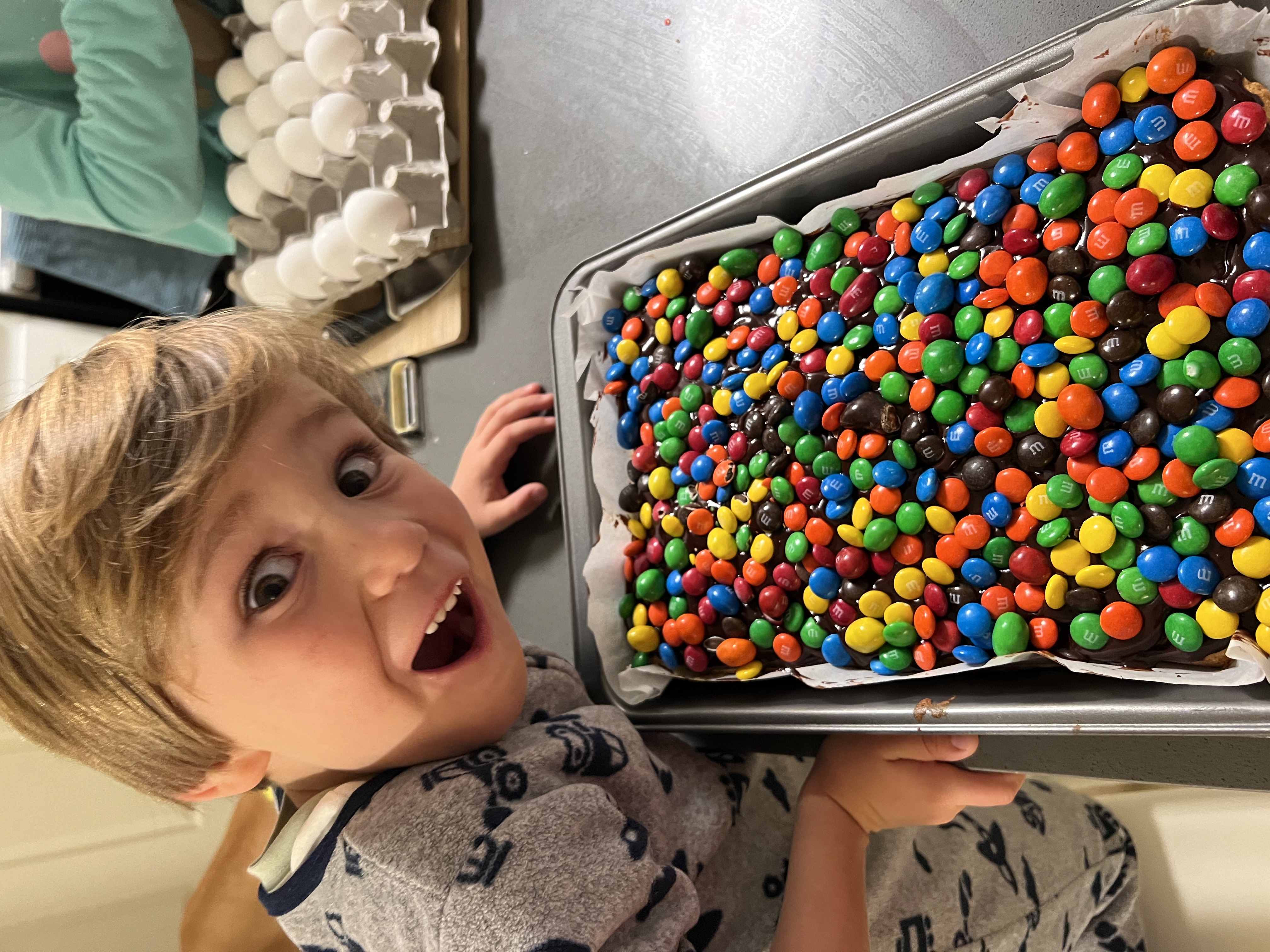 Img: food, sweets, person, candy, body part, finger, hand