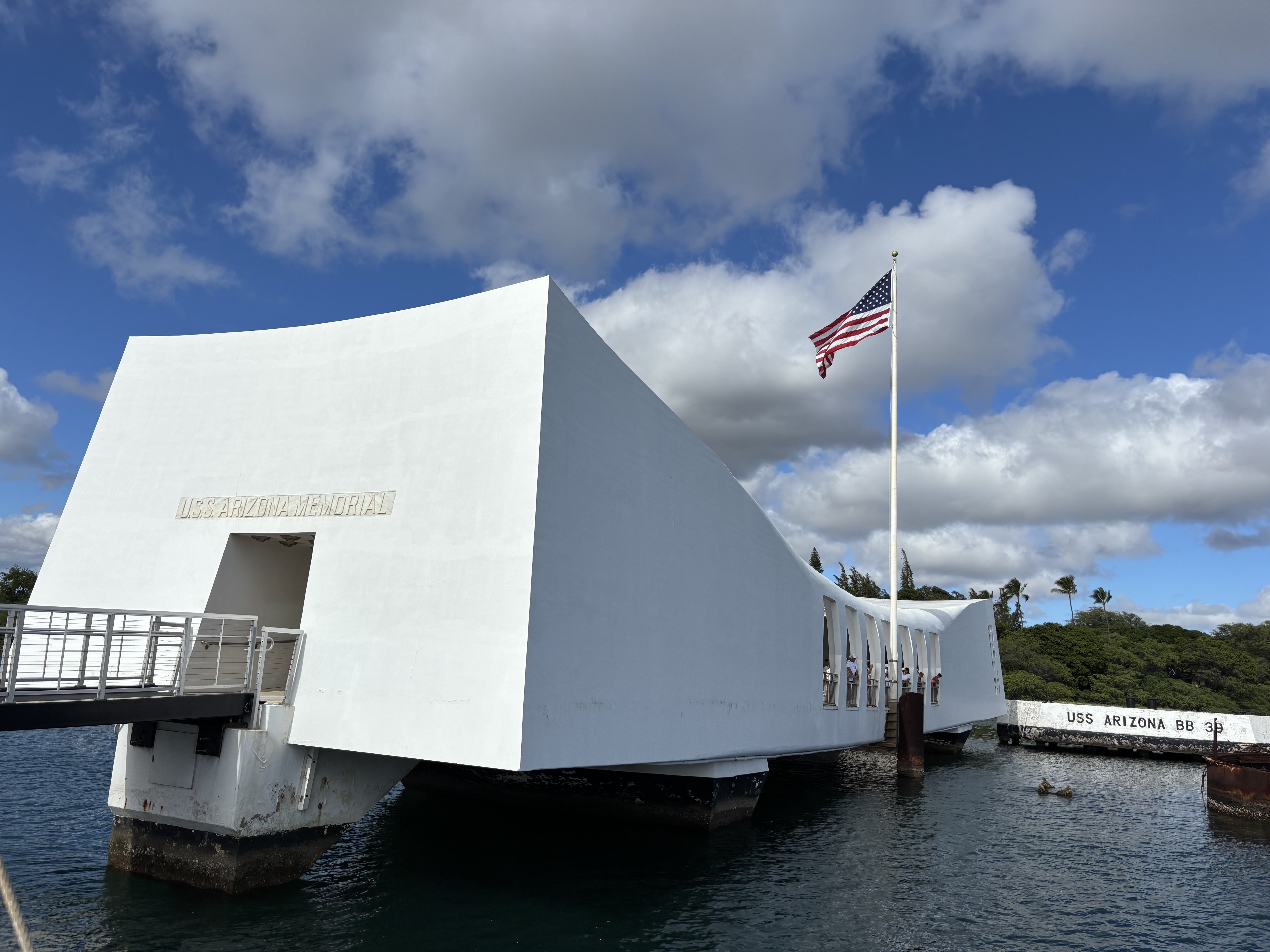 Img: water, waterfront, flag, outdoors, shelter, pier, port, person, arch, handrail
