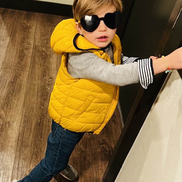 Img: sunglasses, coat, pants, jacket, boy, child, male, person, wood, shoe