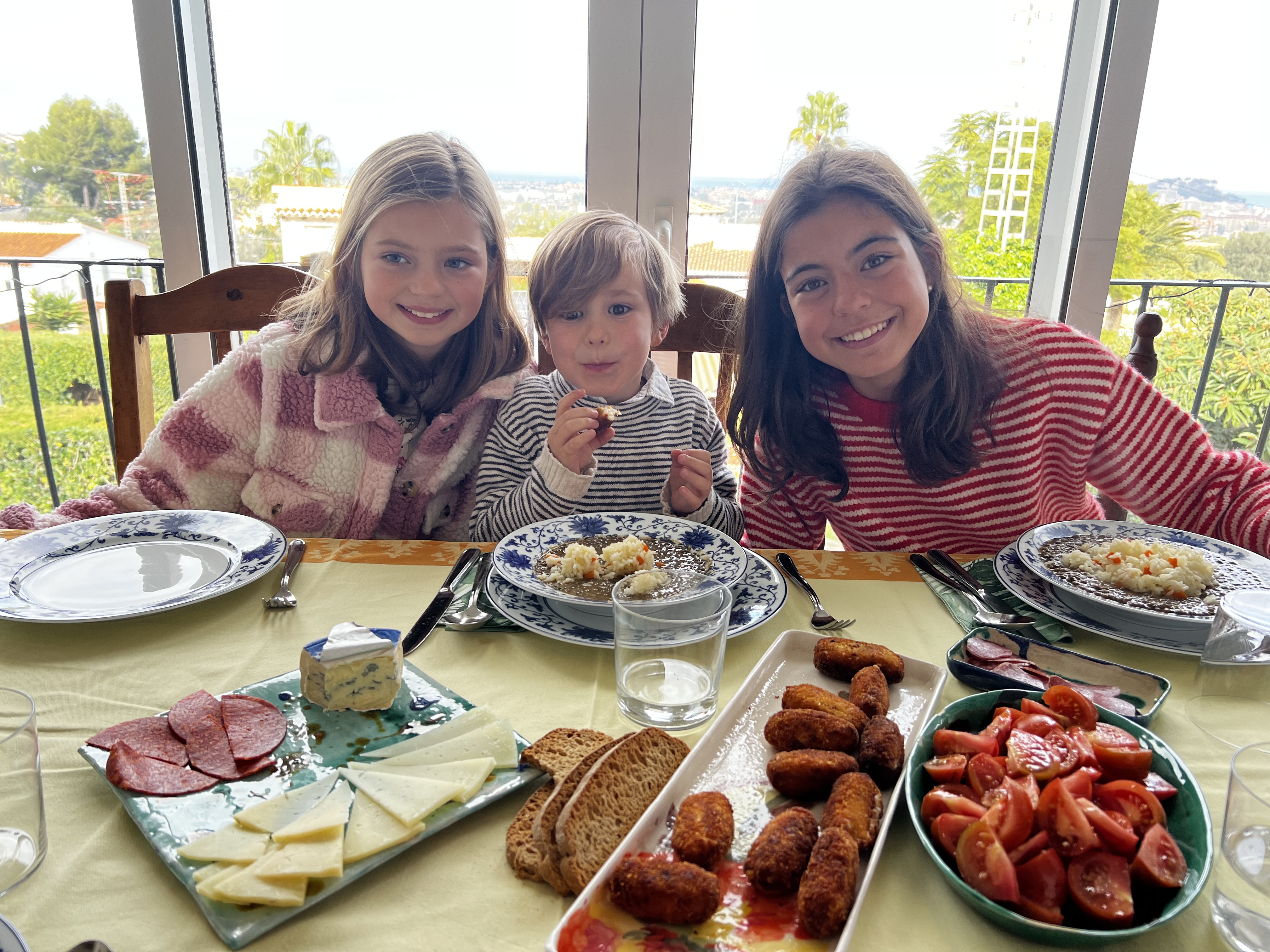 Img: brunch, lunch, meal, fork, dining table, restaurant, knife, dining room, person, woman