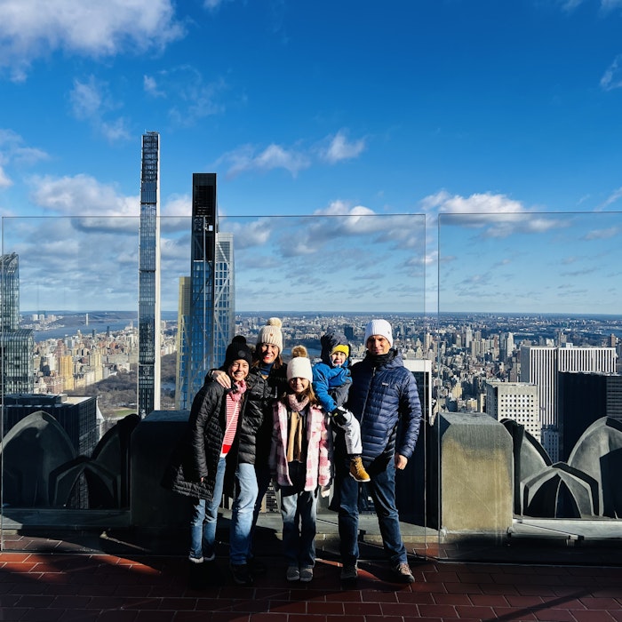 Img: city, urban, pants, cityscape, metropolis, shoe, jeans, coat, high rise, person