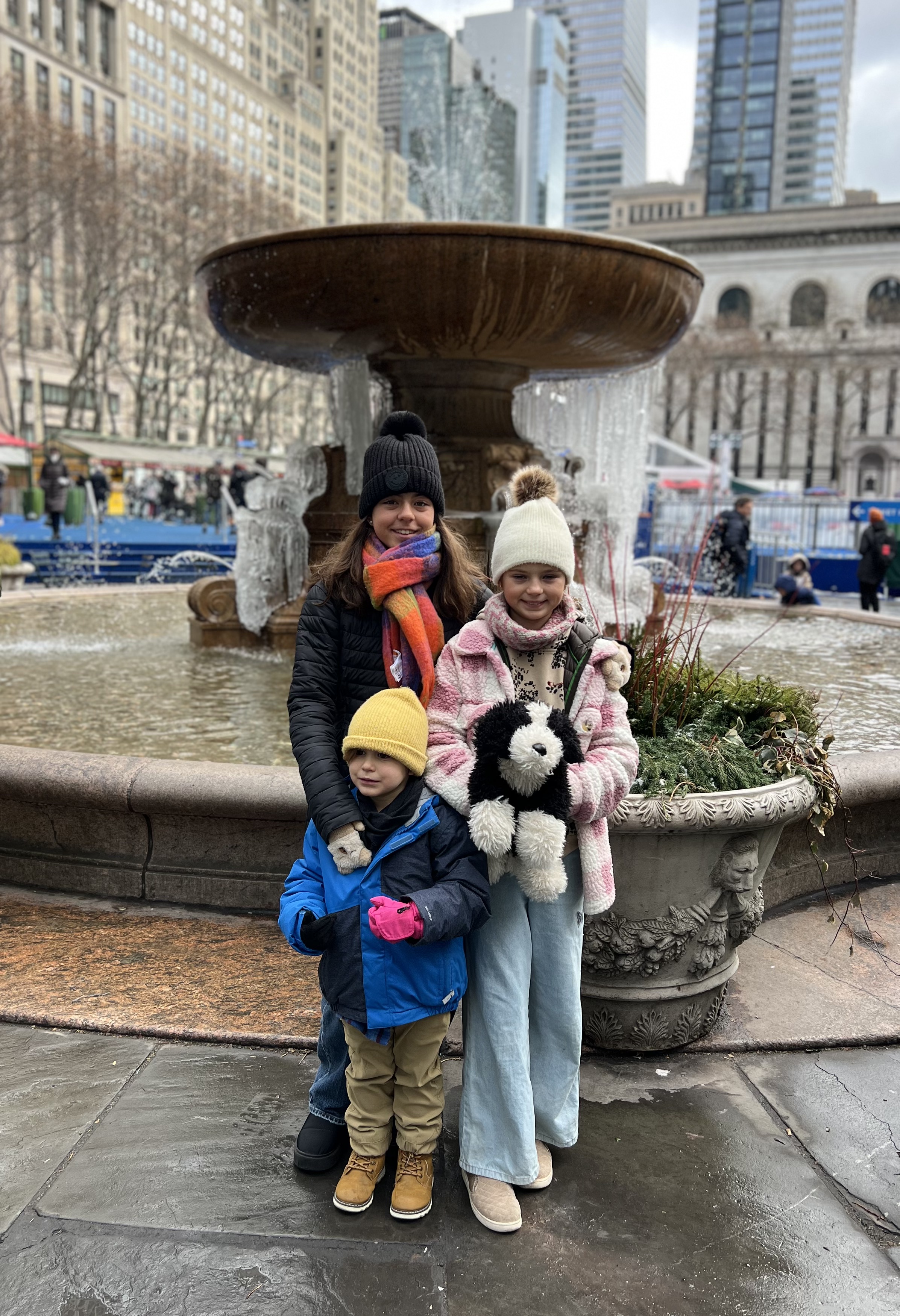 Img: pants, coat, fountain, water, photography, portrait, city, glove, jacket, urban