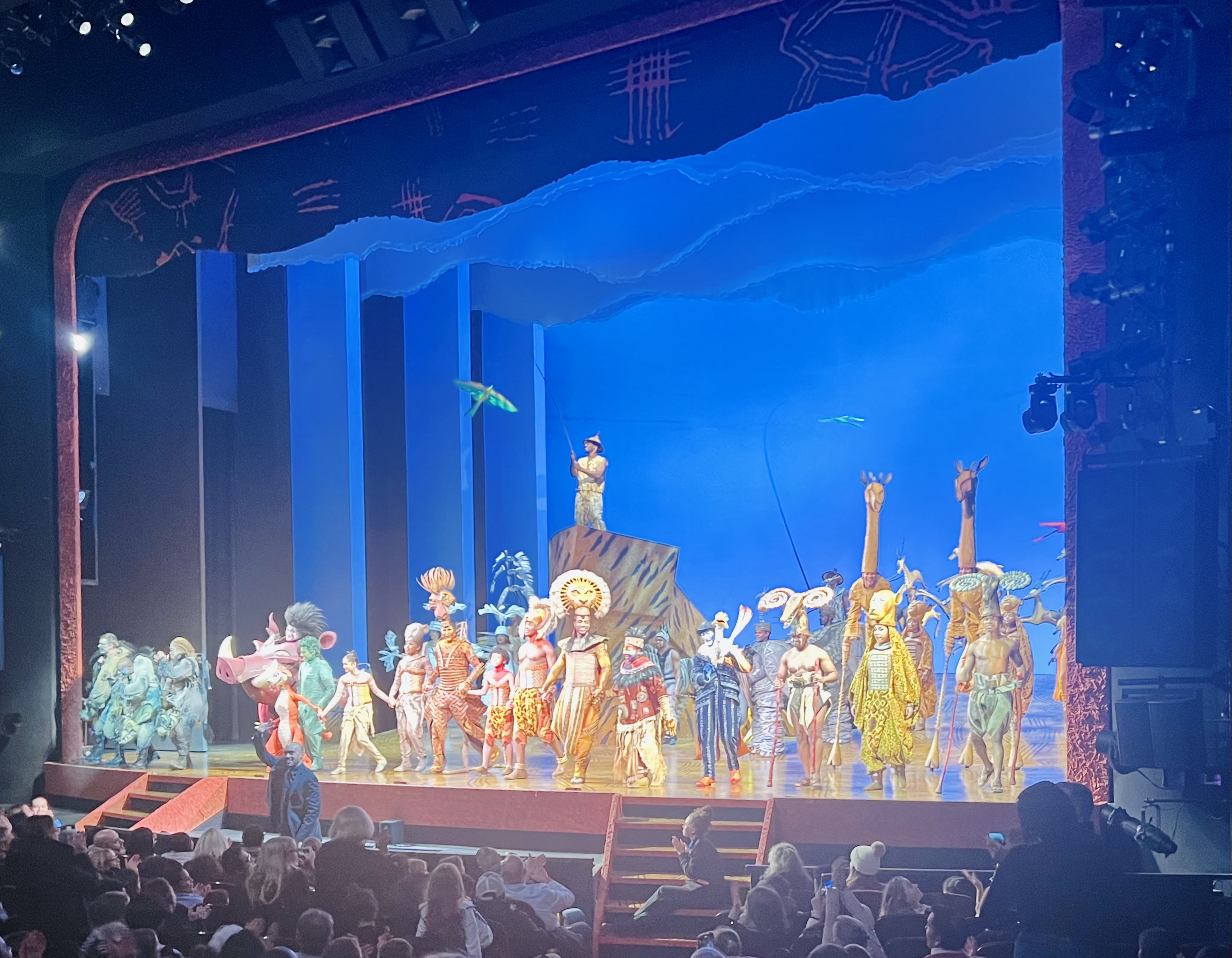 Img: stage, indoors, theater, concert, crowd, person, group performance, urban