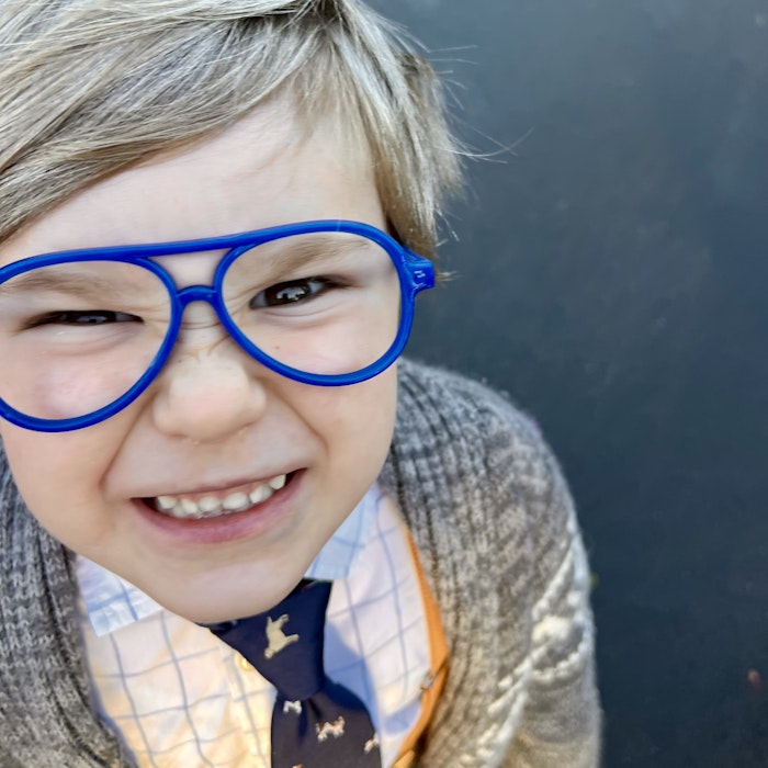 Img: accessories, glasses, face, head, person, photography, portrait, smile, formal wear, tie
