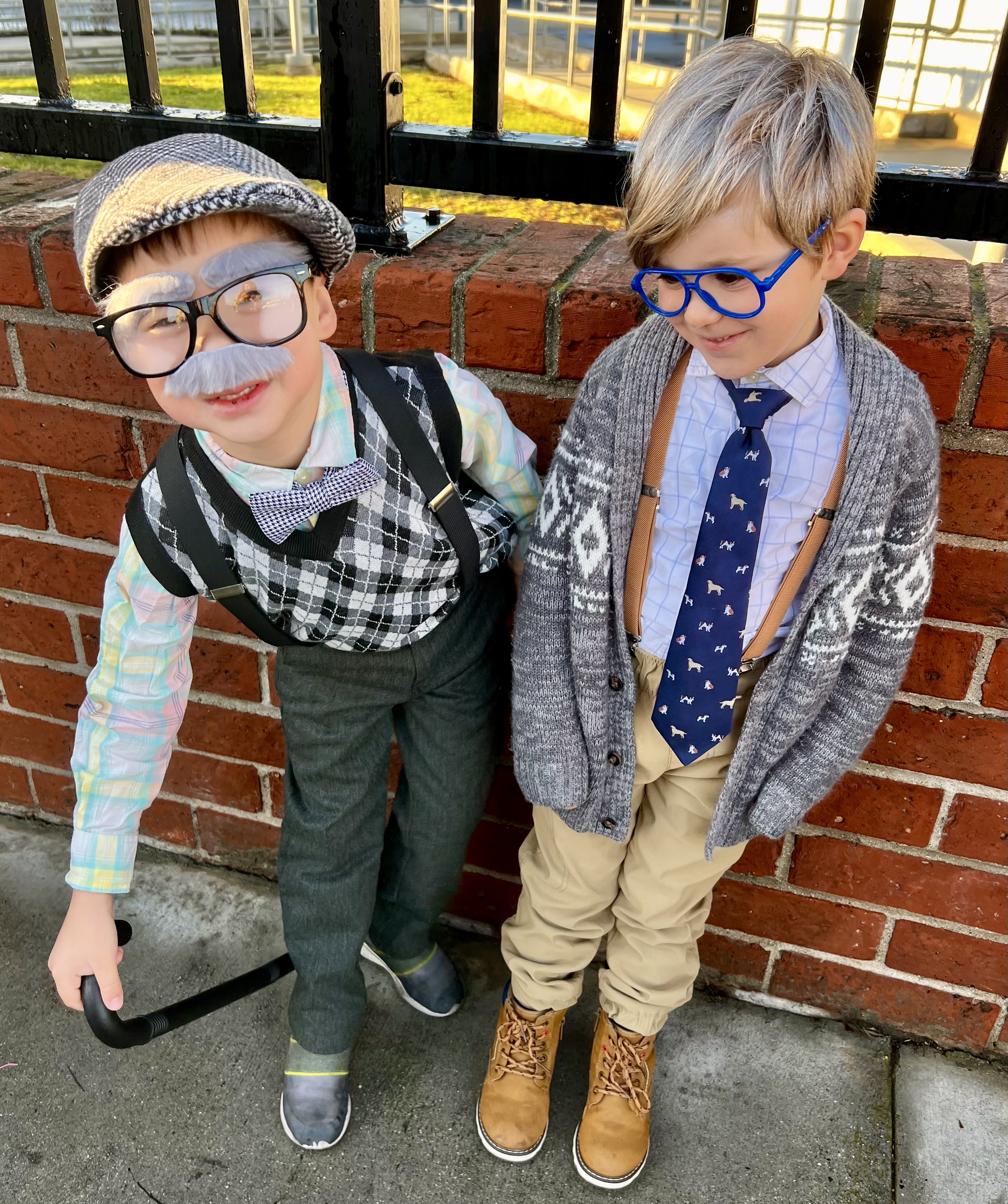 Img: brick, pants, formal wear, tie, glasses, shoe, coat, jacket, blazer, portrait