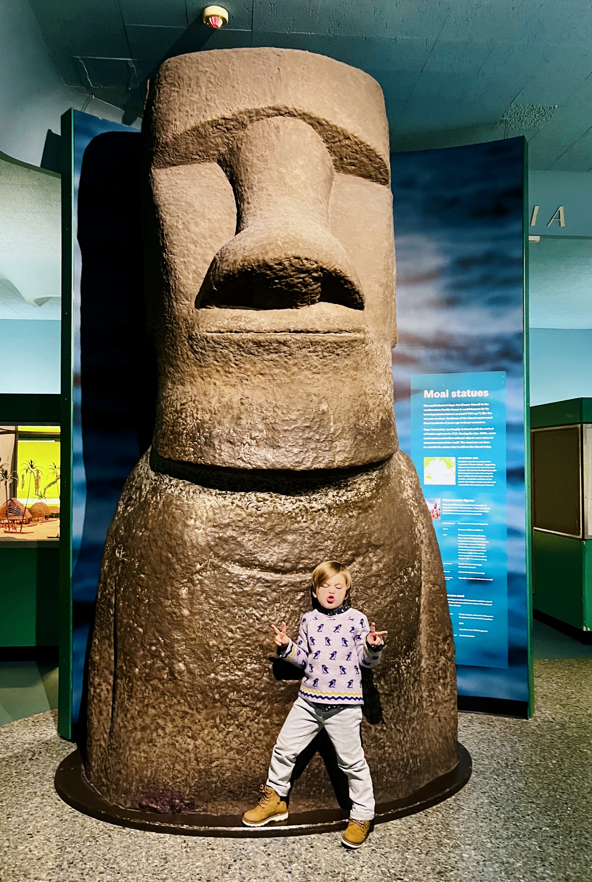 Img: emblem, symbol, person, architecture, pillar, footwear, shoe, totem, face, portrait