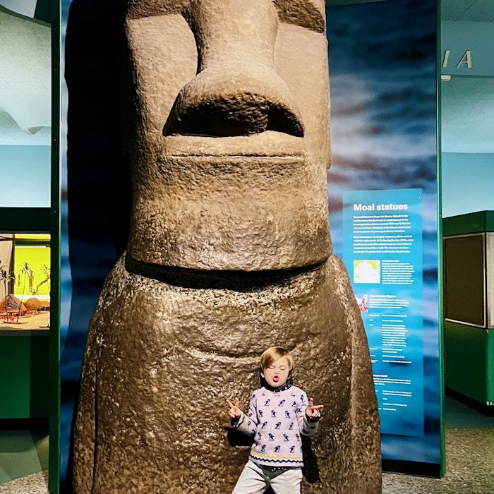 Img: emblem, symbol, person, architecture, pillar, footwear, shoe, totem, face, portrait