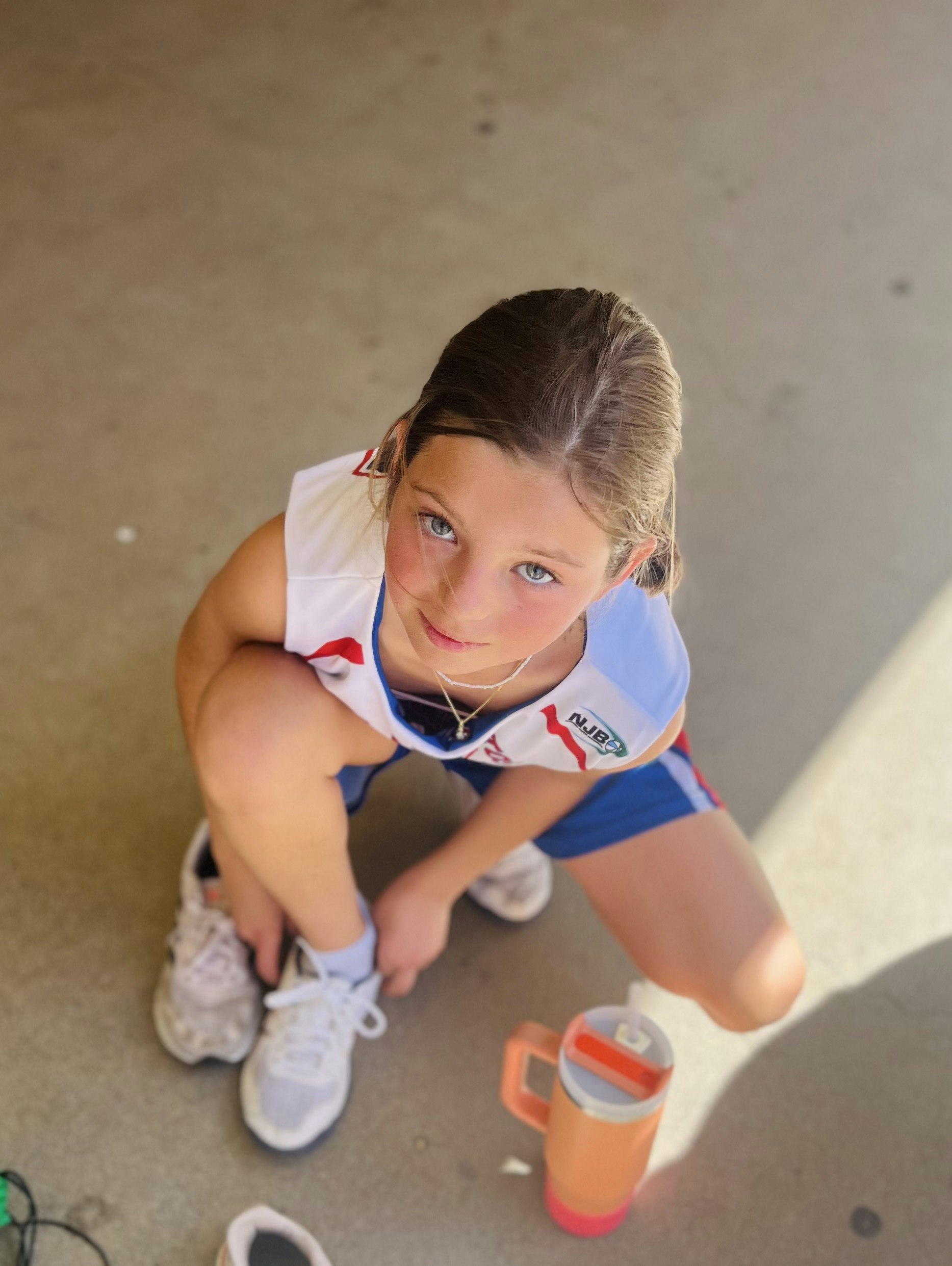 Img: child, female, girl, person, footwear, shoe, portrait, shorts, necklace, cup