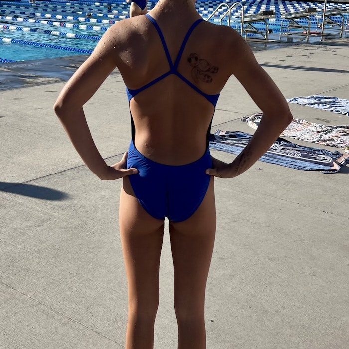 Img: clothing, swimwear, cap, hat, person, back, bathing cap, bikini, footwear, shoe