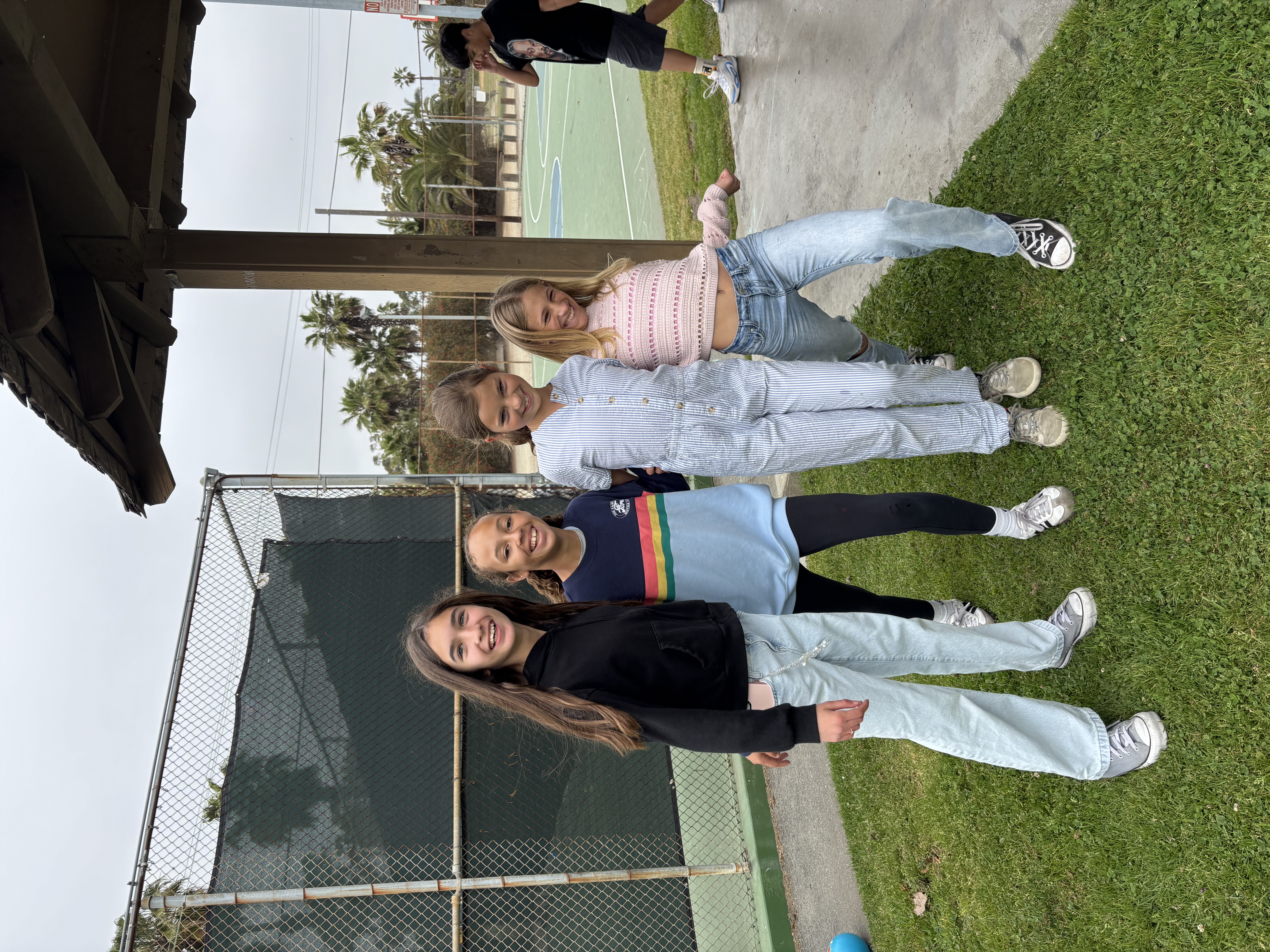 Img: pants, grass, people, person, female, girl, teen, park, shoe, jeans