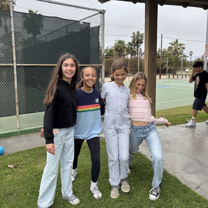 Img: pants, grass, people, person, female, girl, teen, park, shoe, jeans