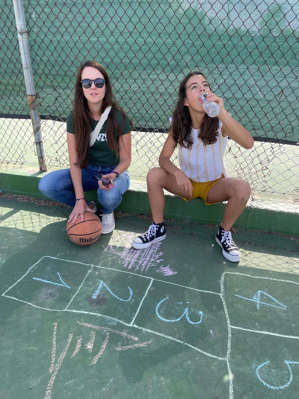 Photo 2025: female, girl, person, teen, shoe, basketball (ball), portrait, glasses, pants, sitting