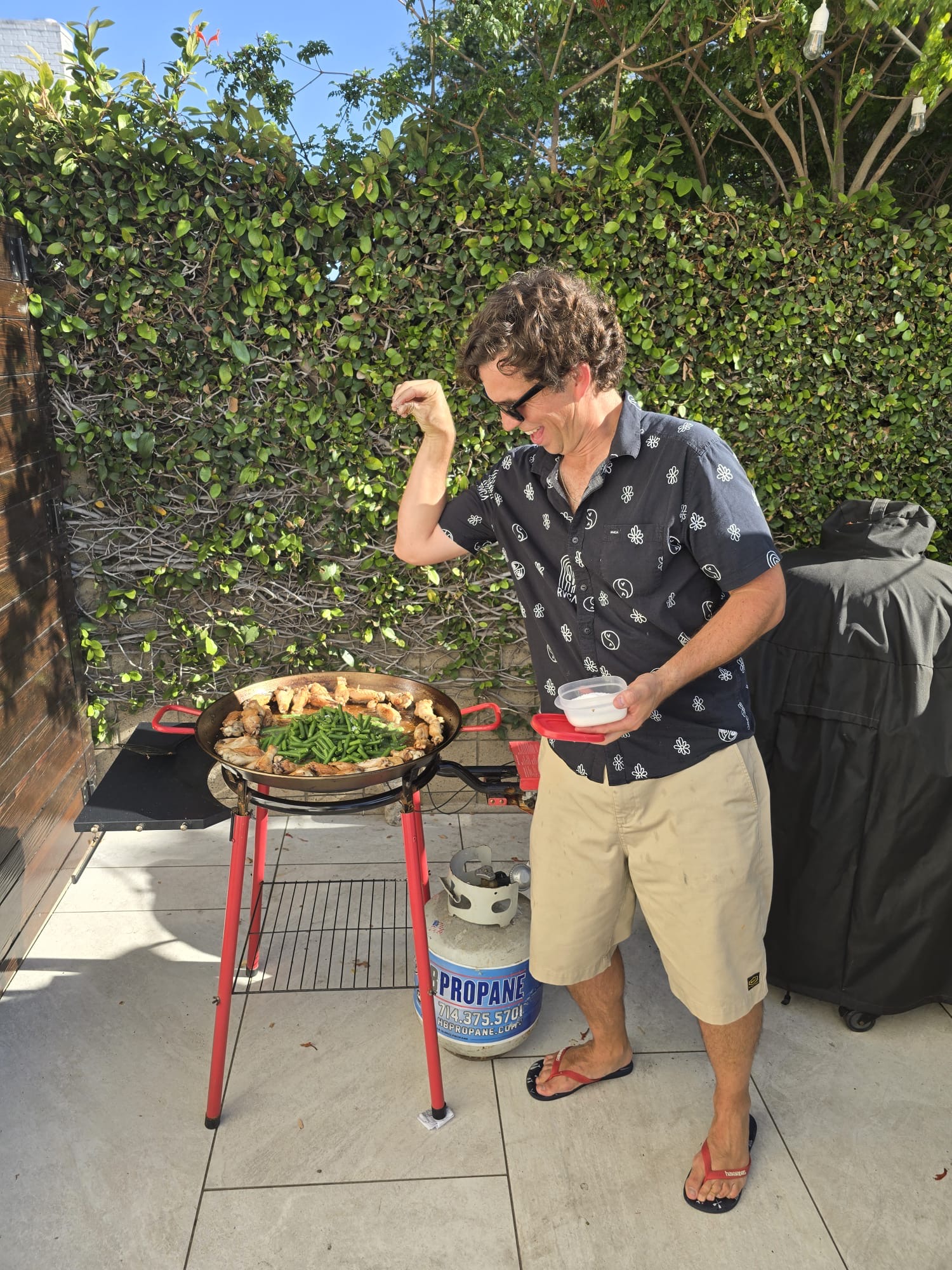 14f32f11 B0c9 4aea 9c71 76583373f1c0: bbq, cooking, grilling, adult, male, man, person, footwear, shoe, glasses