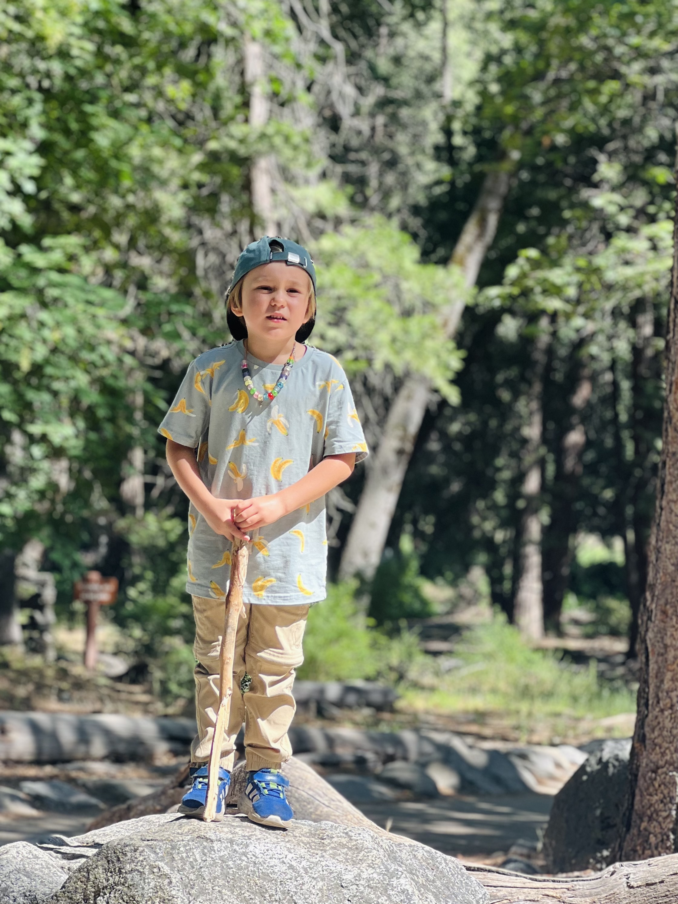 Img: clothing, sleeve, boy, child, male, person, shoe, hat, necklace, standing