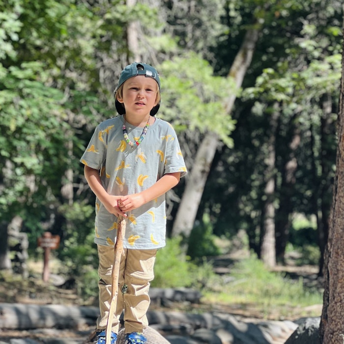 Img: clothing, sleeve, boy, child, male, person, shoe, hat, necklace, standing