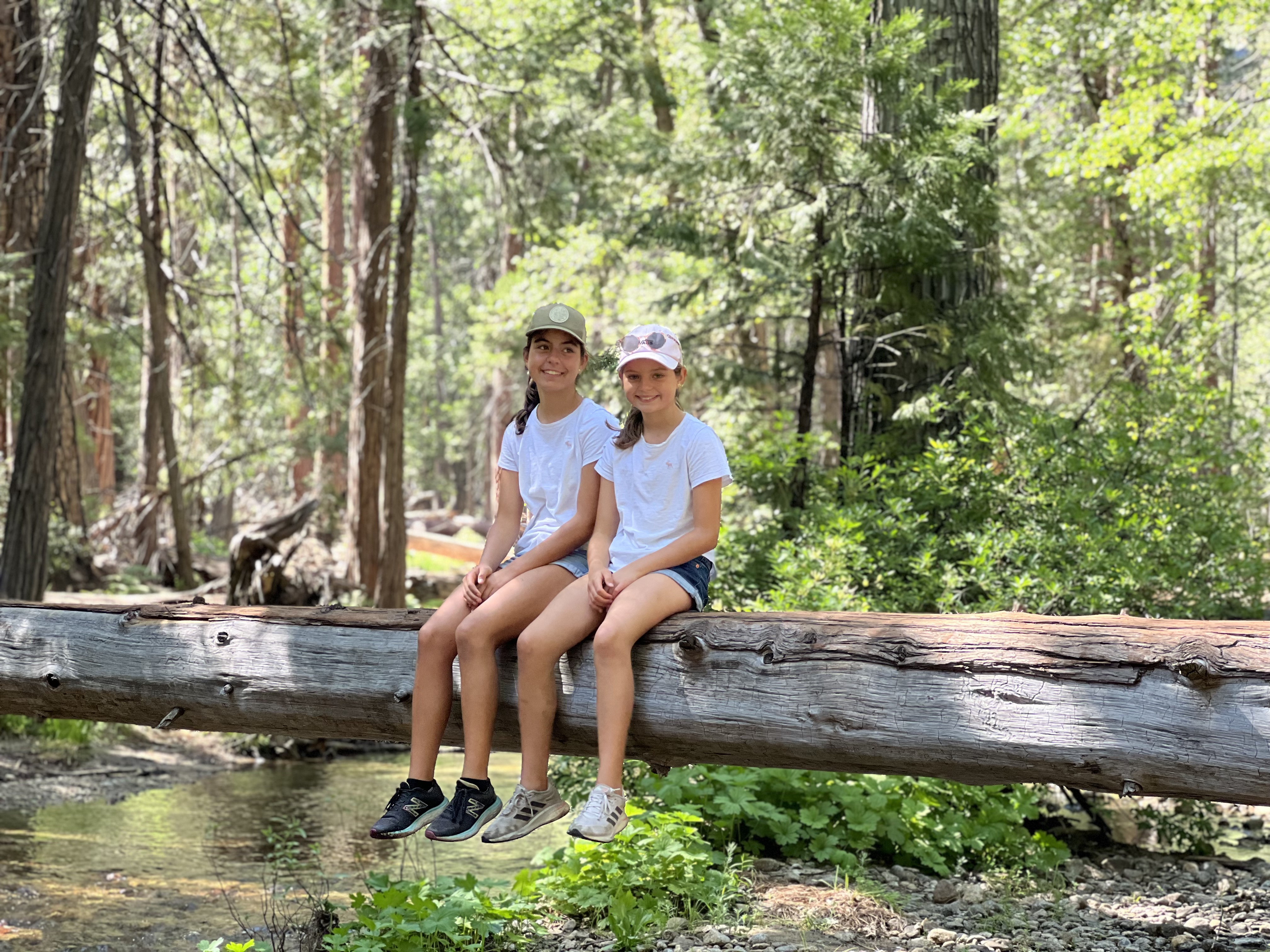 Img: person, sitting, vegetation, shoe, female, girl, teen, hat, land, woodland