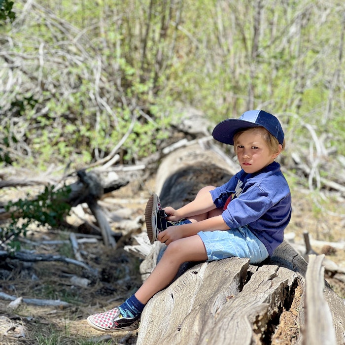 Img: tree, person, sitting, wood, rock, photography, portrait, baseball cap, wilderness, shoe