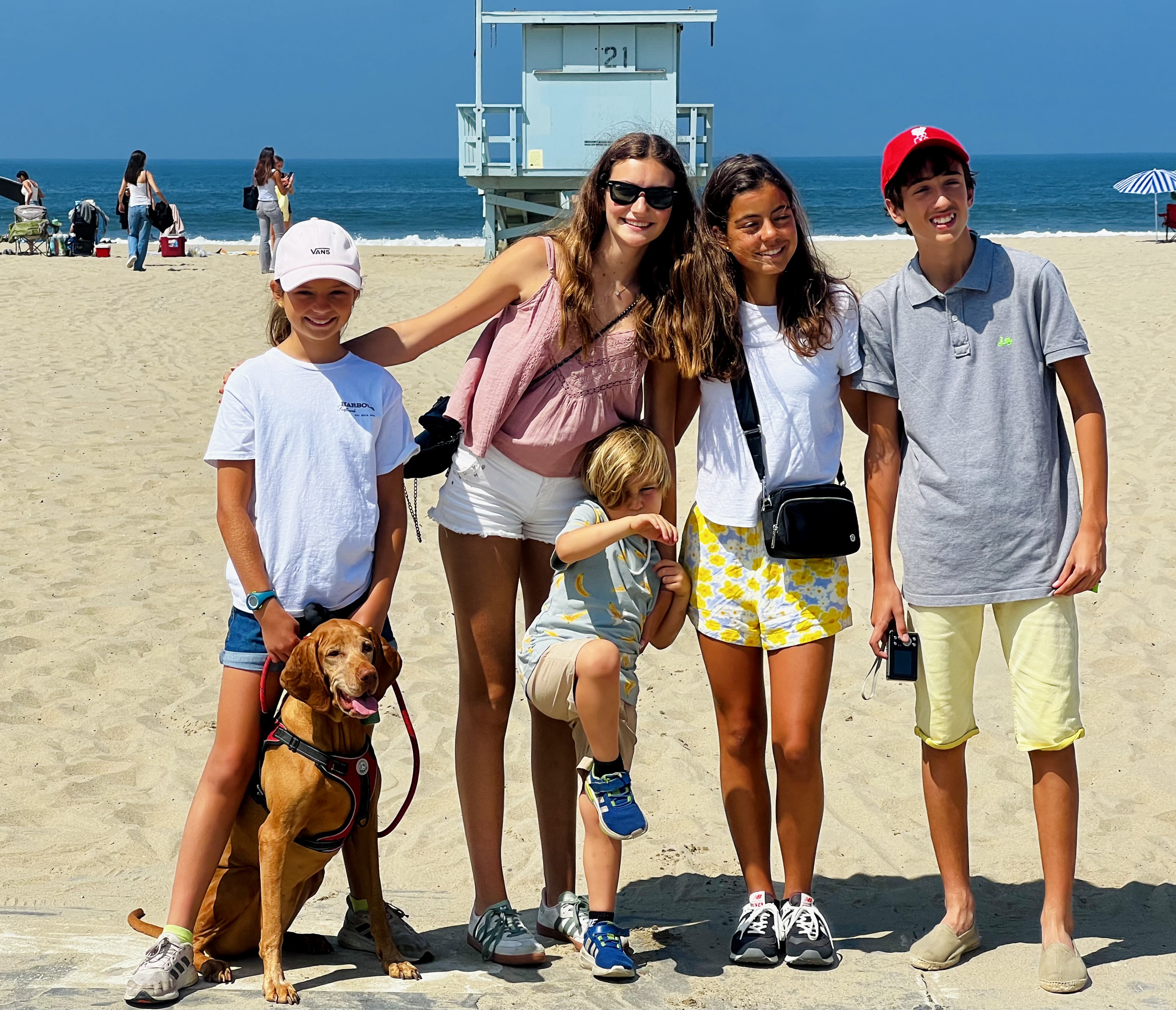 Img: female, girl, person, teen, shorts, handbag, hat, people, glasses, shoe