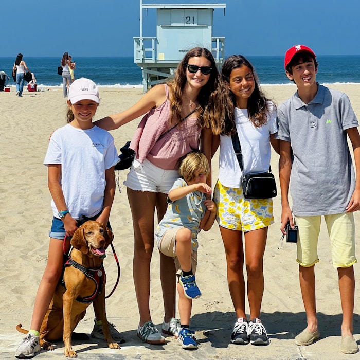 Img: female, girl, person, teen, shorts, handbag, hat, people, glasses, shoe