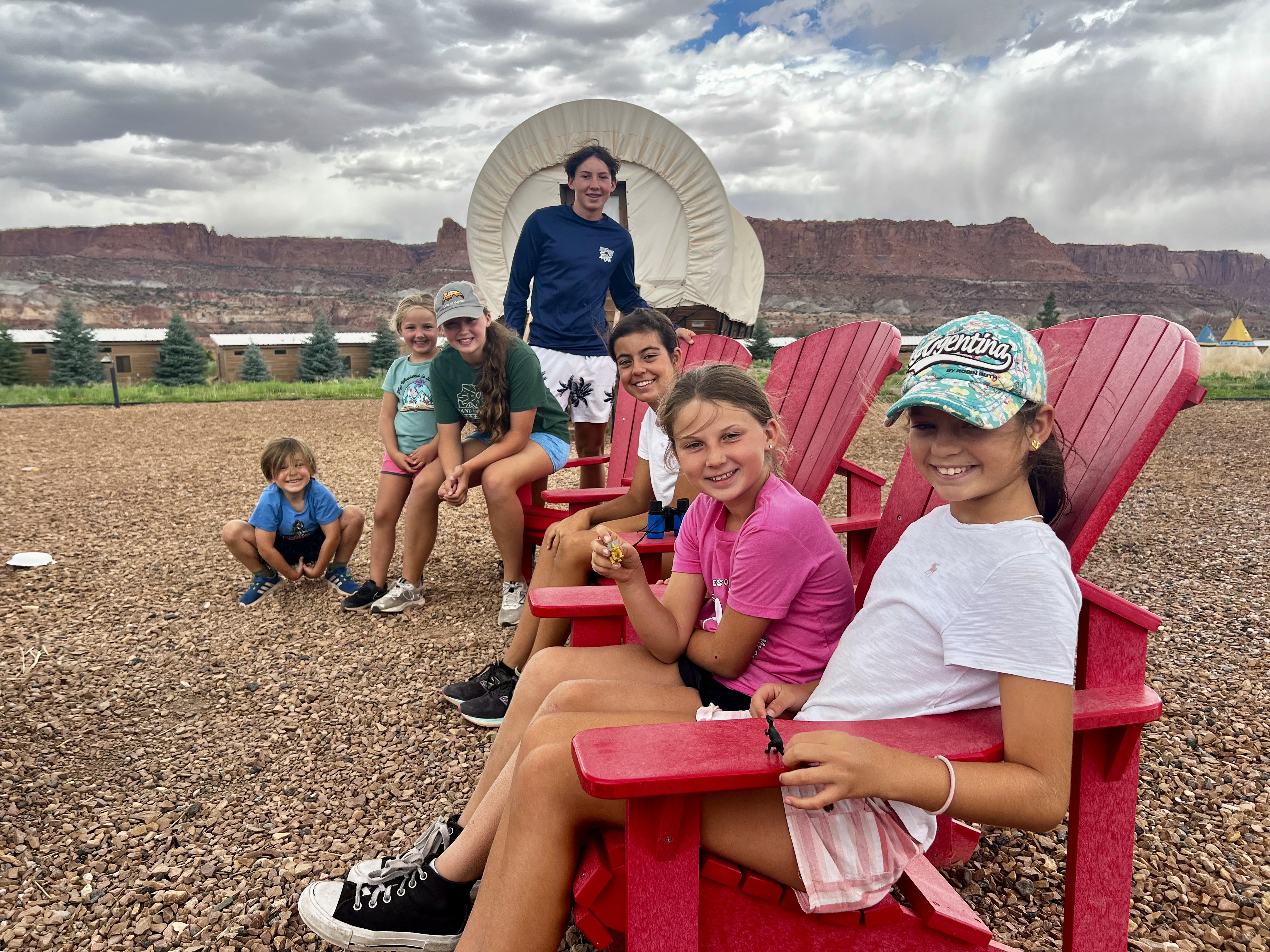 Img: boy, child, male, person, adult, man, shoe, hat, shorts, shelter