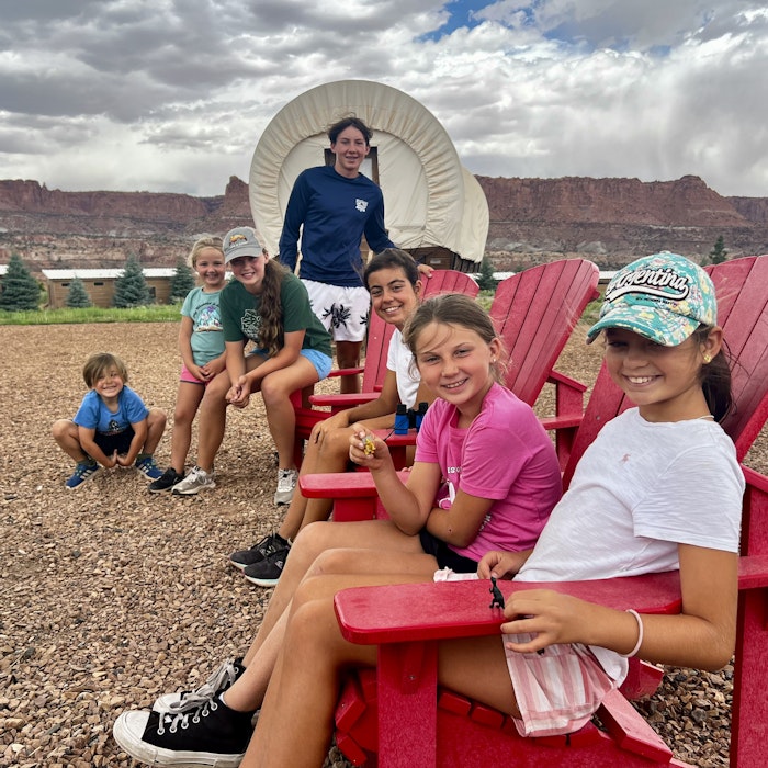 Img: boy, child, male, person, adult, man, shoe, hat, shorts, shelter