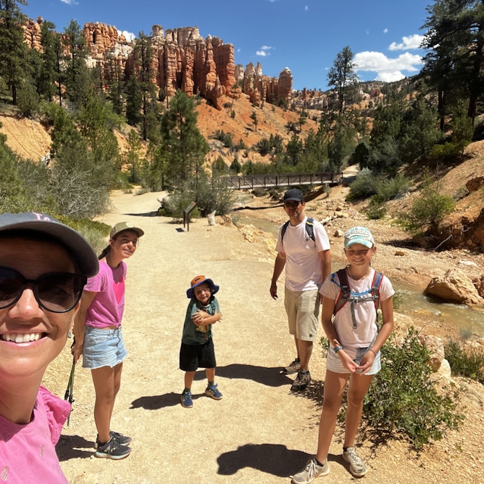 Img: wilderness, hiking, person, sunglasses, rock, vegetation, shoe, hat, path, glasses