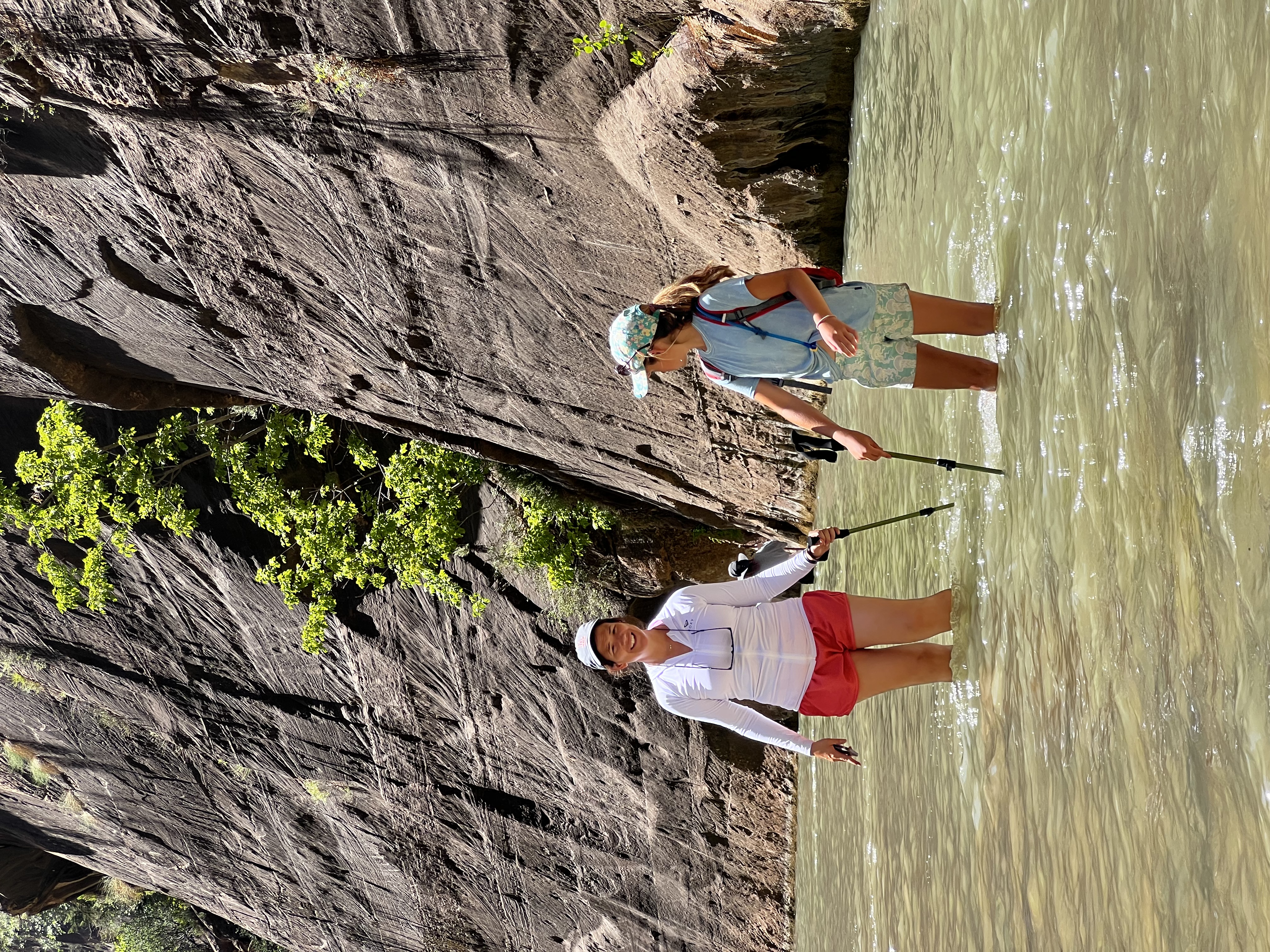 Img: rock, shorts, hiking, outdoors, person, walking, hat, adult, female, woman