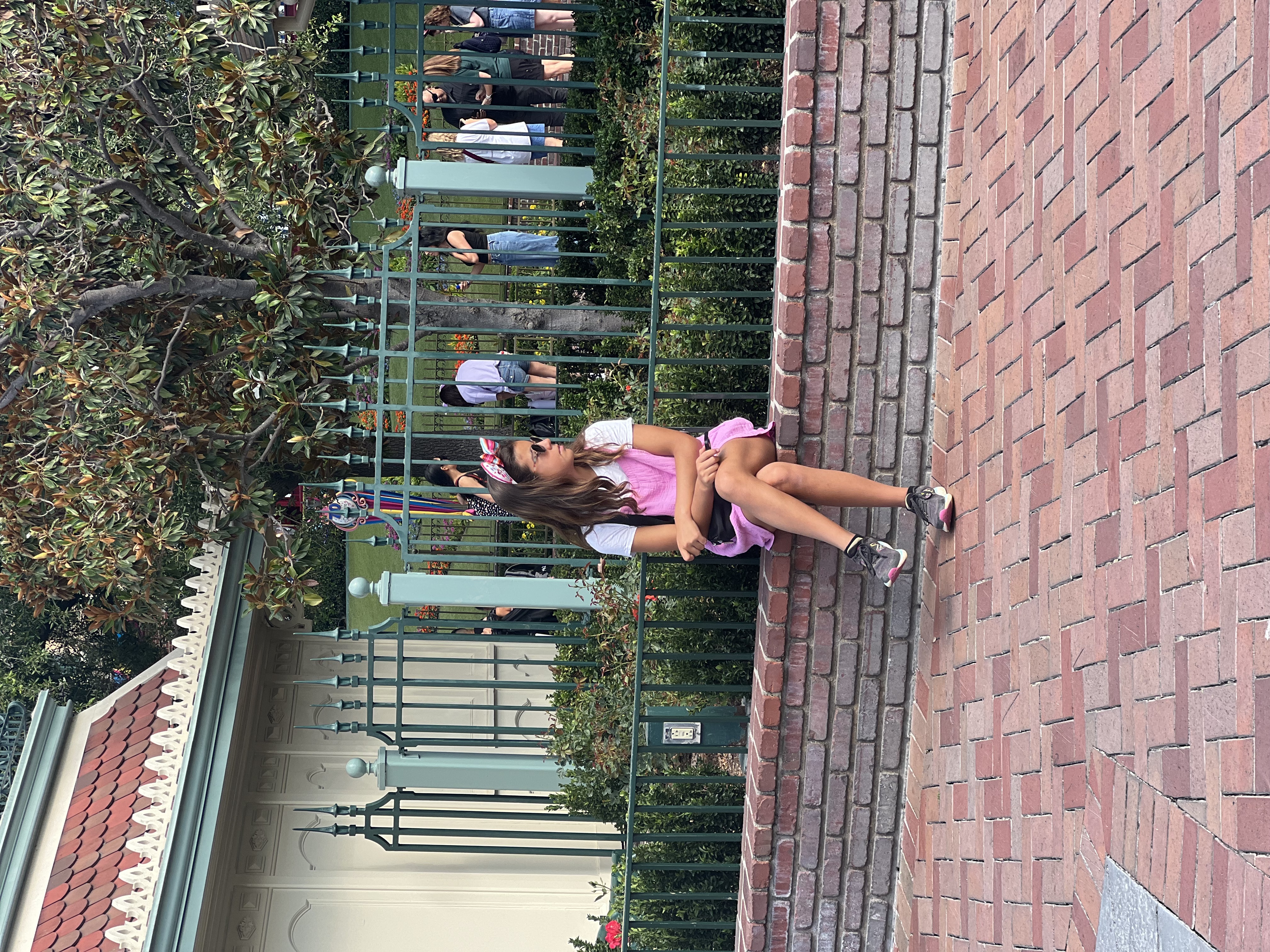 Img: person, sitting, clothing, footwear, shoe, child, female, girl, bag, handbag