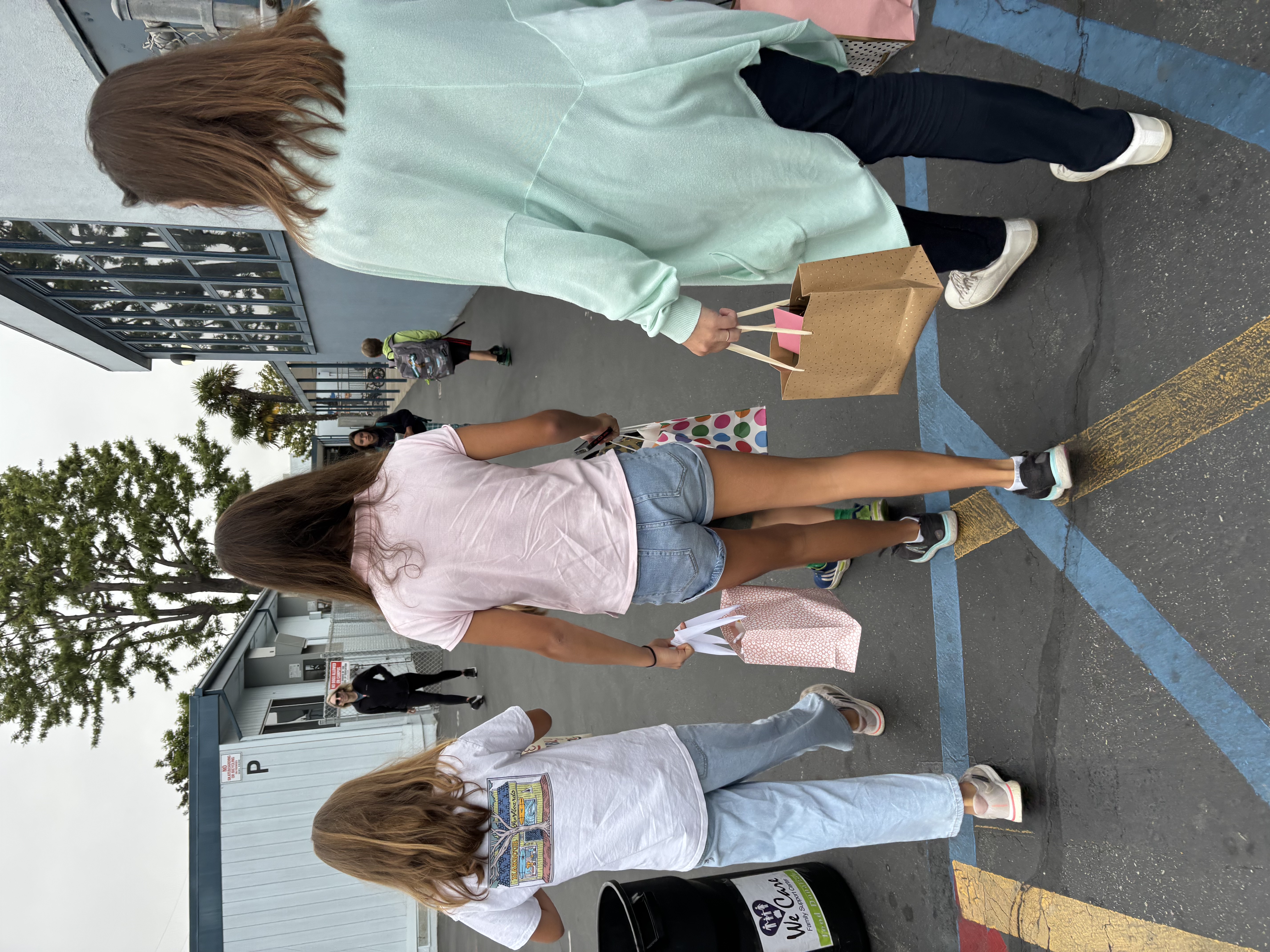 Img: person, walking, shoe, handbag, shorts, pants, child, female, girl, city