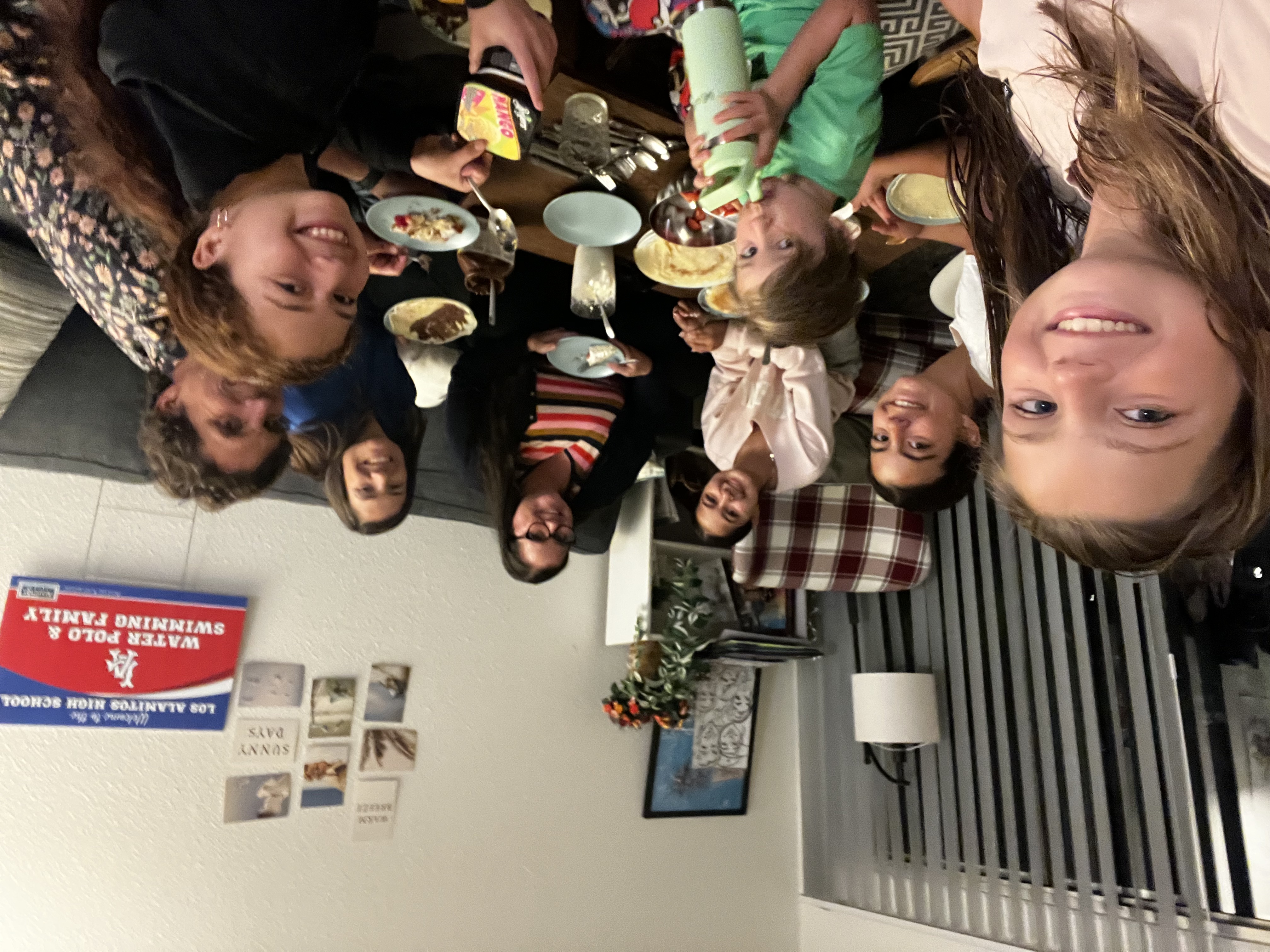 Img: dining room, dining table, table, people, person, meal, adult, female, woman, couch