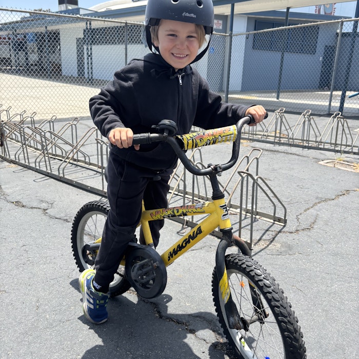 Img: footwear, shoe, helmet, boy, child, male, person, bicycle, vehicle, cycling