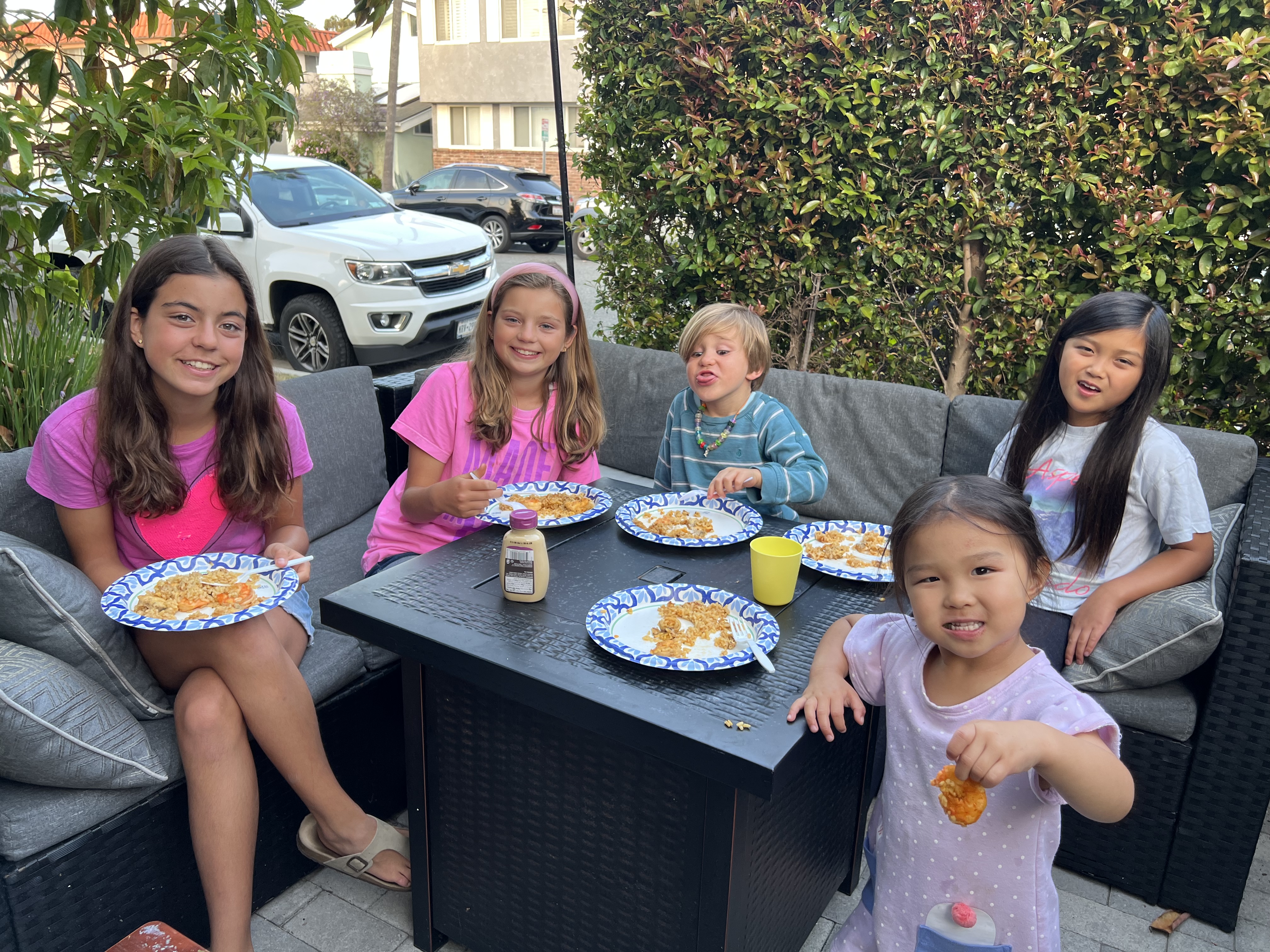 Img: lunch, people, person, dining table, table, cup, shoe, plate, child, girl