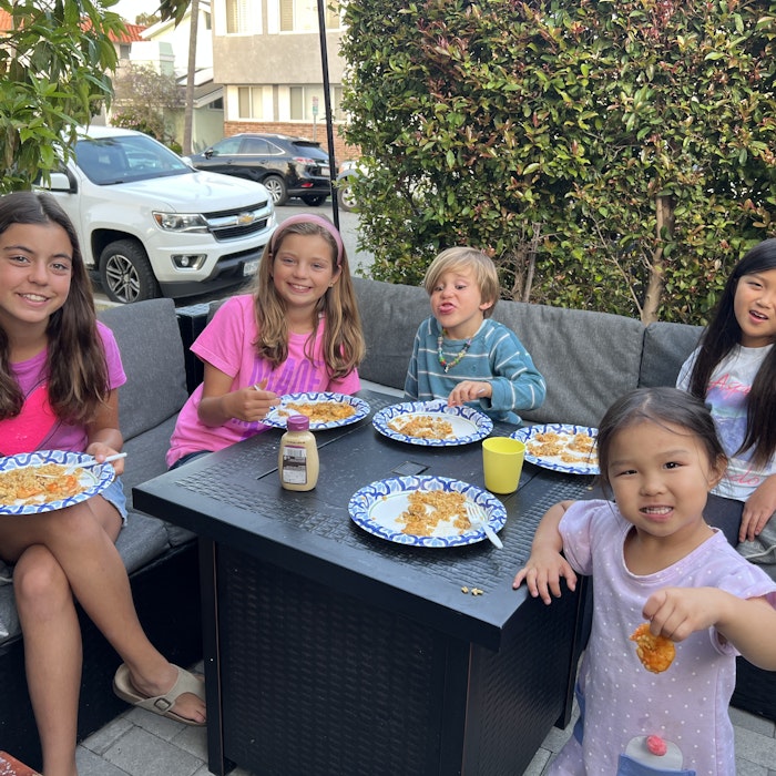 Img: lunch, people, person, dining table, table, cup, shoe, plate, child, girl