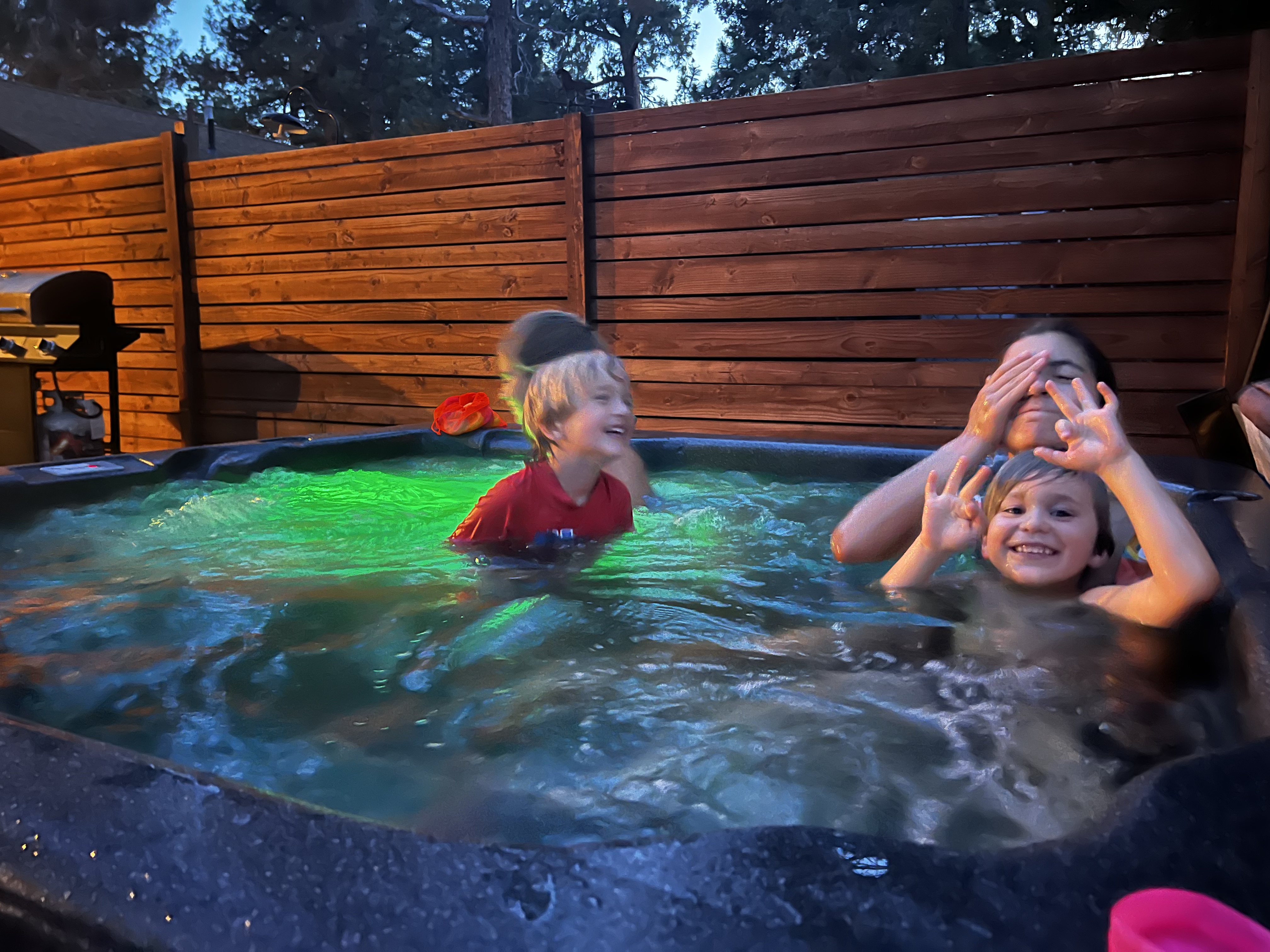 Img: tub, hot tub, child, female, girl, person, baby, backyard, handbag, hat