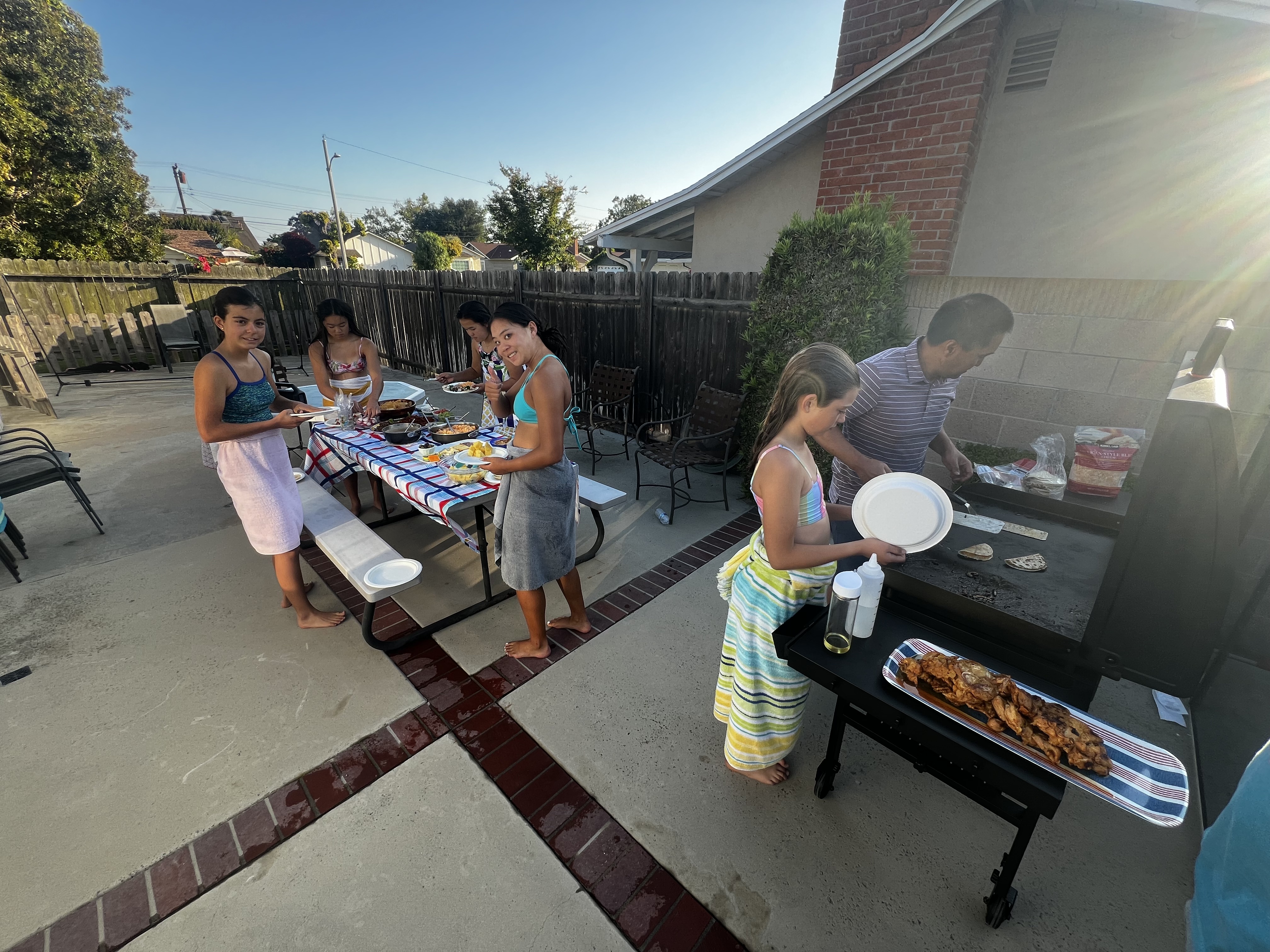 Img: bbq, adult, female, person, woman, bench, chair, male, man, plate