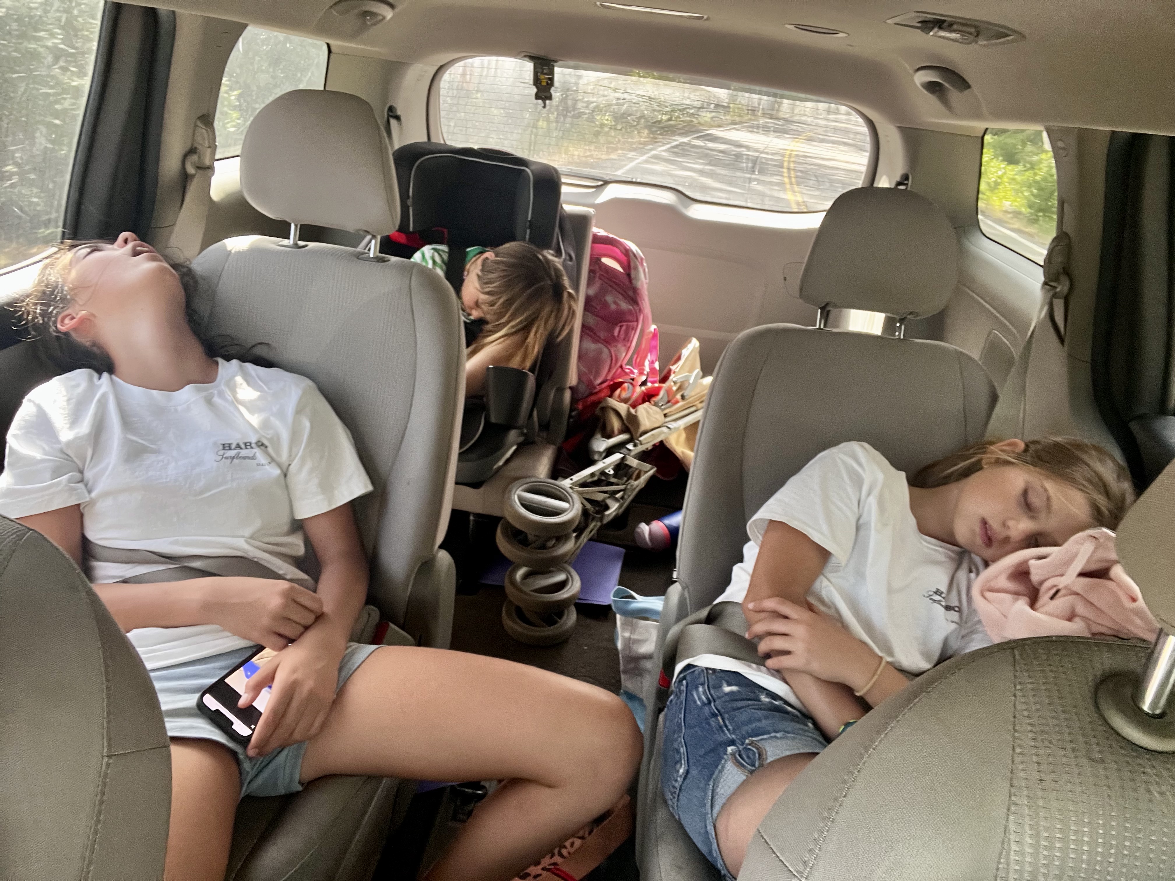 Img: person, bracelet, adult, female, woman, mobile phone, chair, home decor, cushion, car