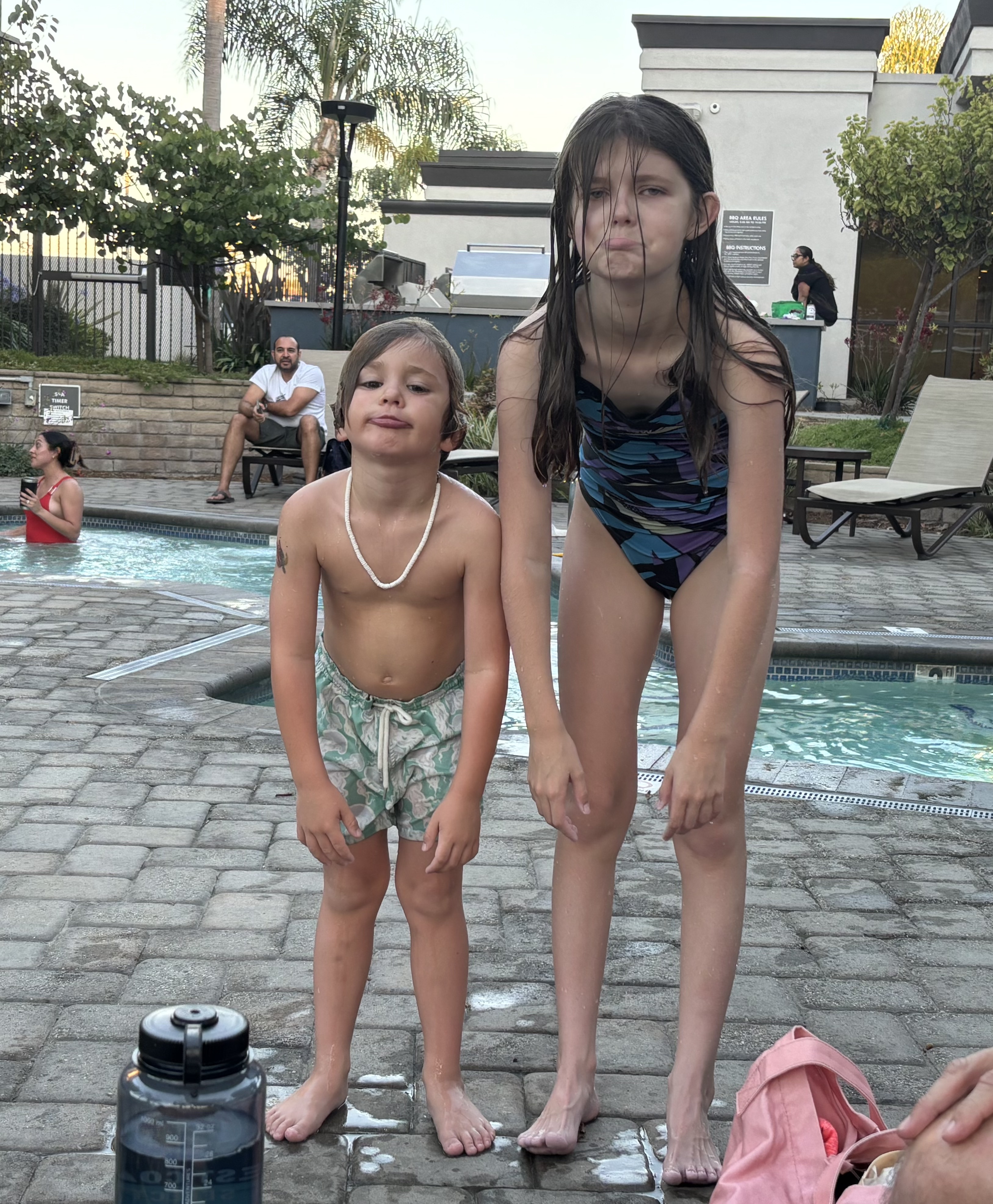 Img: swimwear, adult, female, person, woman, male, man, chair, handbag, necklace