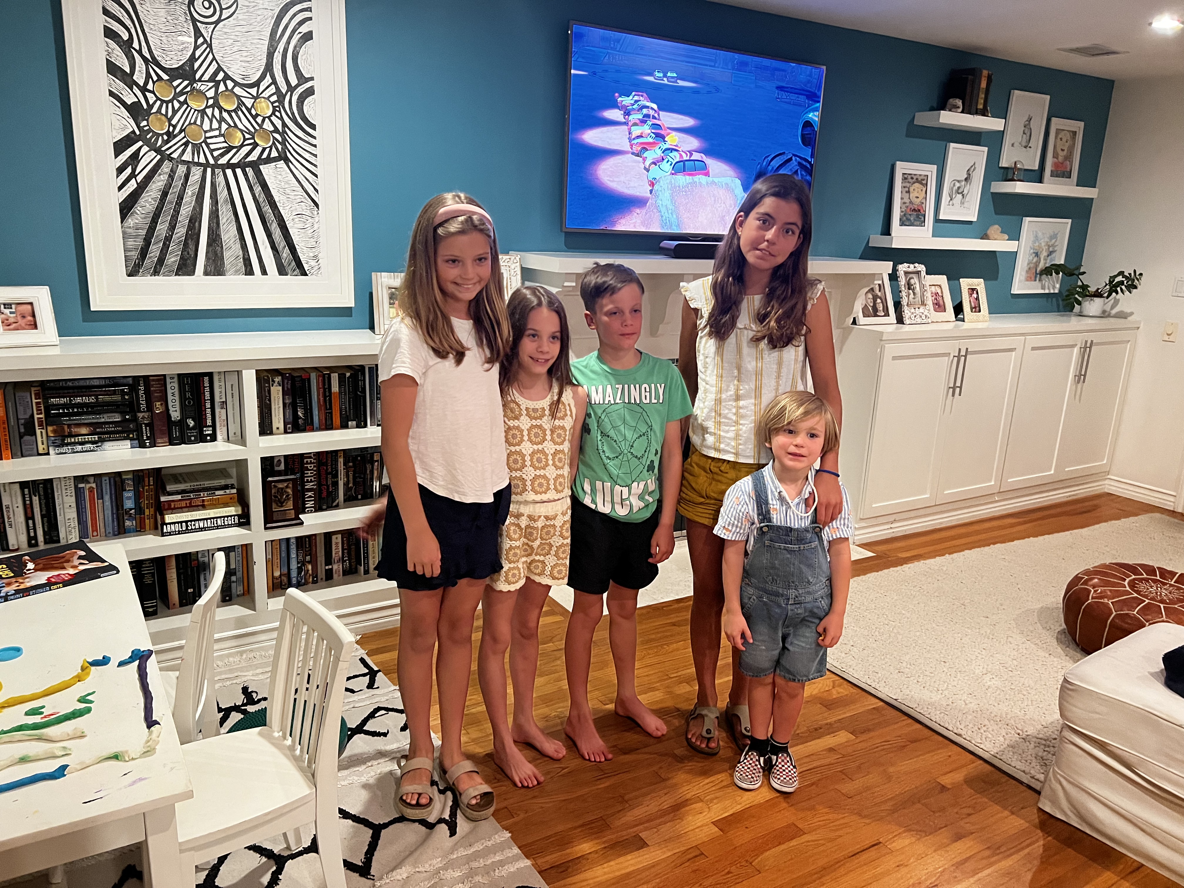 Img: shorts, living room, computer hardware, monitor, screen, person, photography, portrait, girl, teen