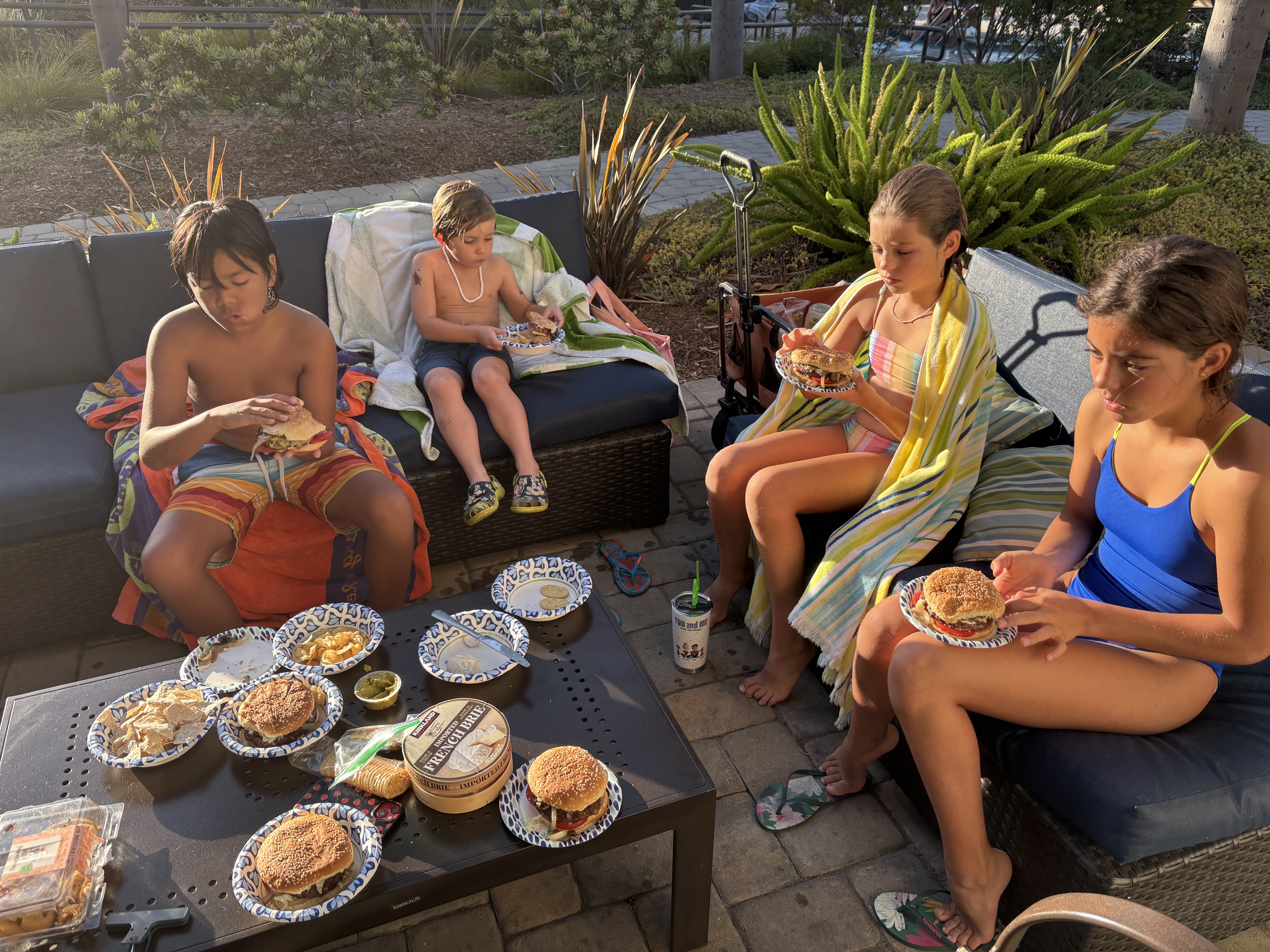 Img: brunch, people, person, adult, female, woman, cup, burger, necklace, shoe