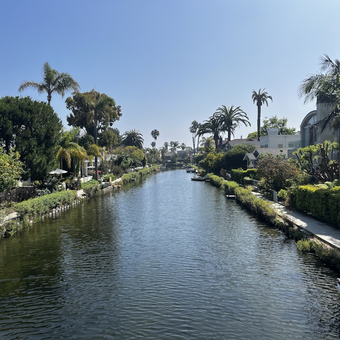 Img: canal, outdoors, water, boat, nature, scenery, tree, cityscape, waterfront, vegetation