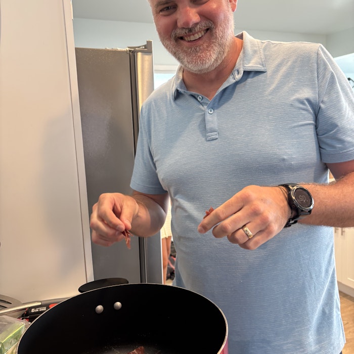 Img: ring, wristwatch, adult, male, man, person, cooking, stirring food, glasses, cooking pot