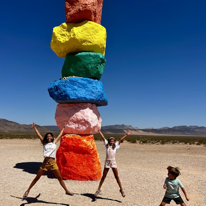 Img: rock, person, female, girl, teen, shorts, shoe, walking, glove, outdoors