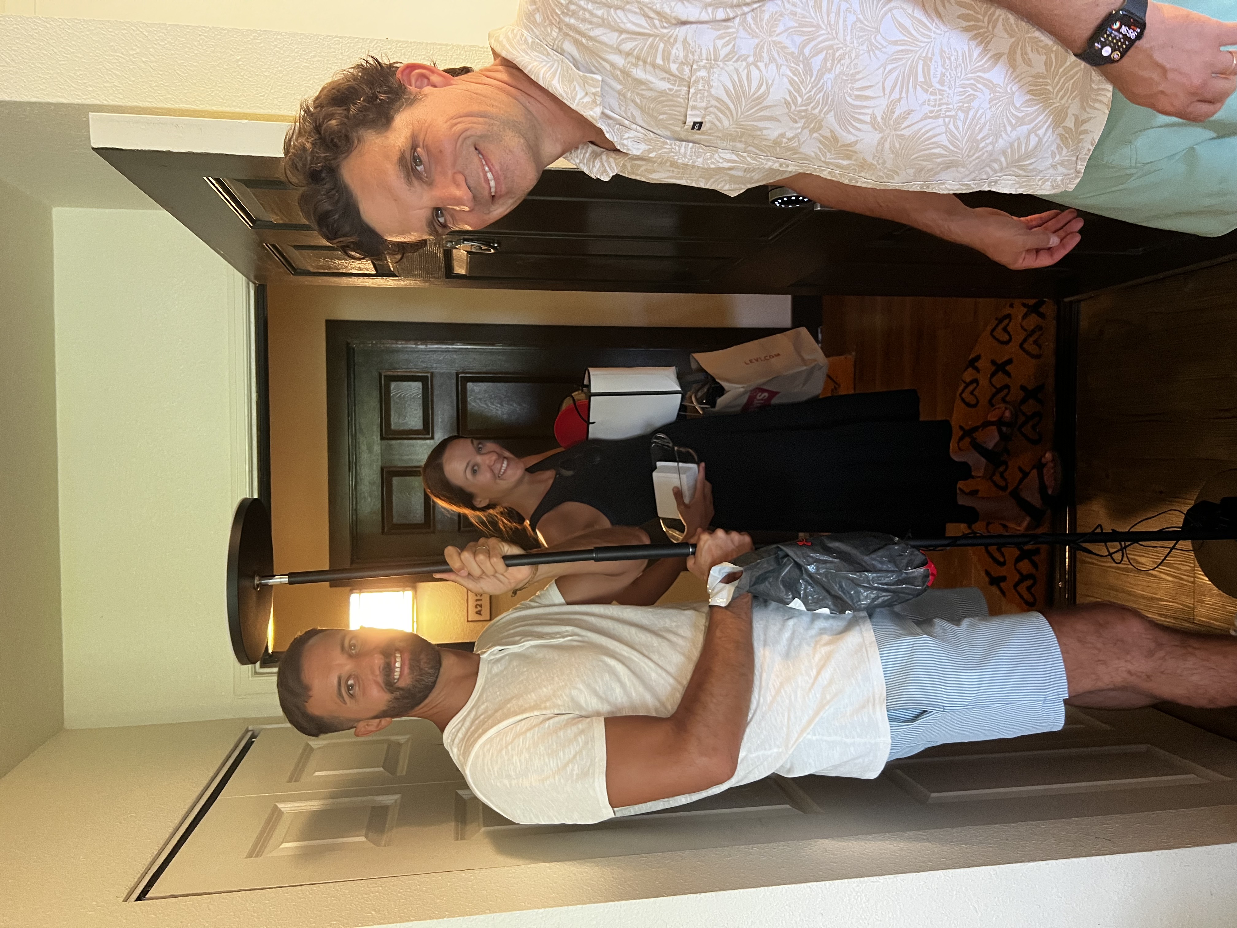 Img: lamp, adult, male, man, person, door, shorts, female, woman, handbag