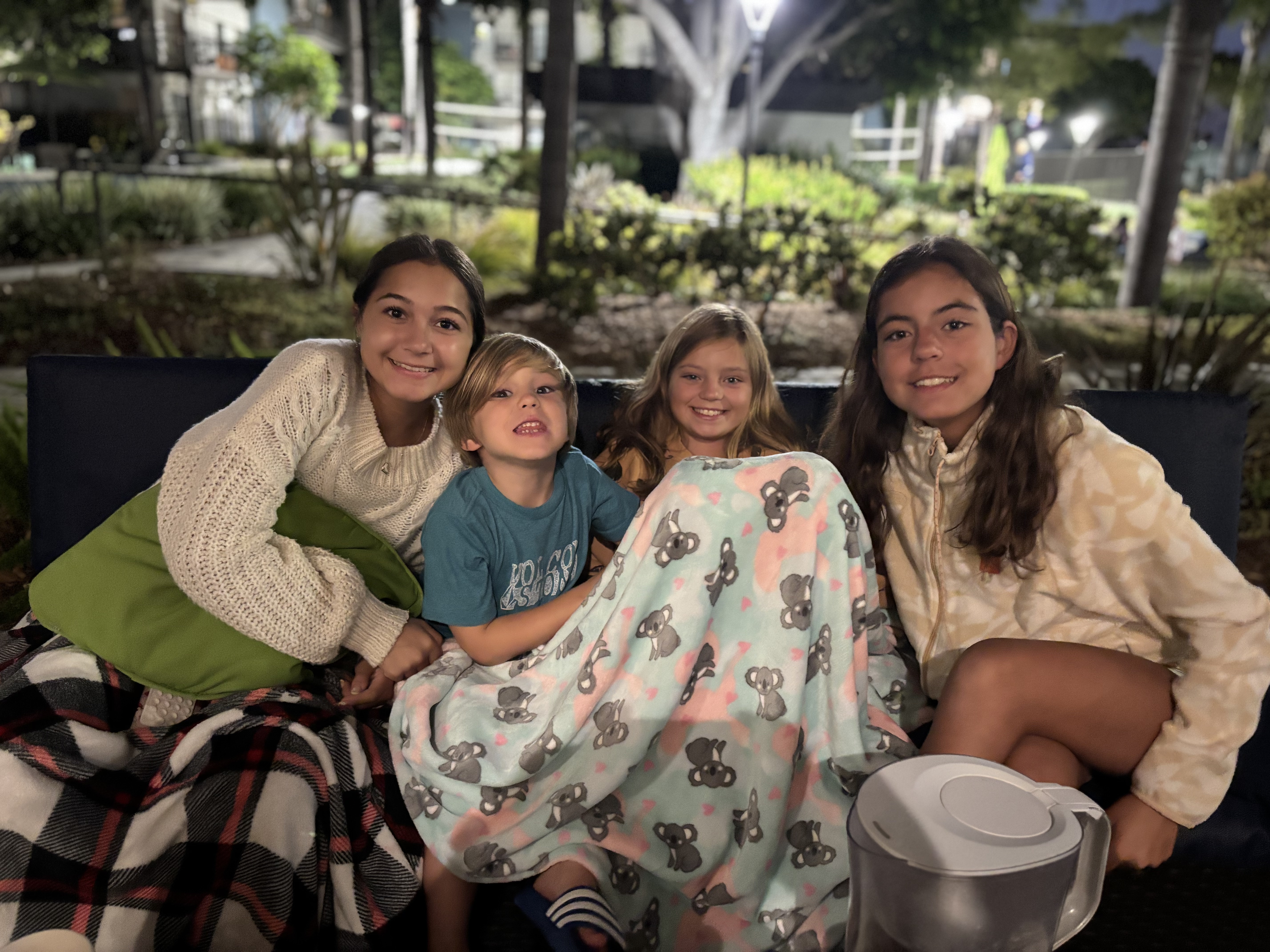 Img: people, person, adult, female, woman, family, child, girl, blanket, potted plant