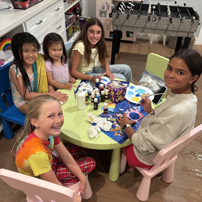 Img: dining table, table, people, person, dining room, child, female, girl, shoe, wristwatch
