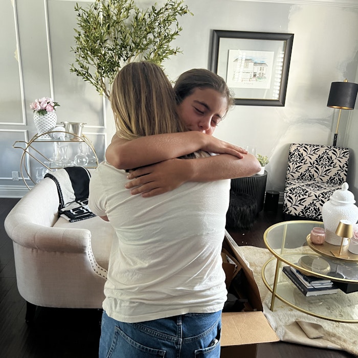 Img: plant, potted plant, lamp, adult, female, person, woman, hugging, photo frame