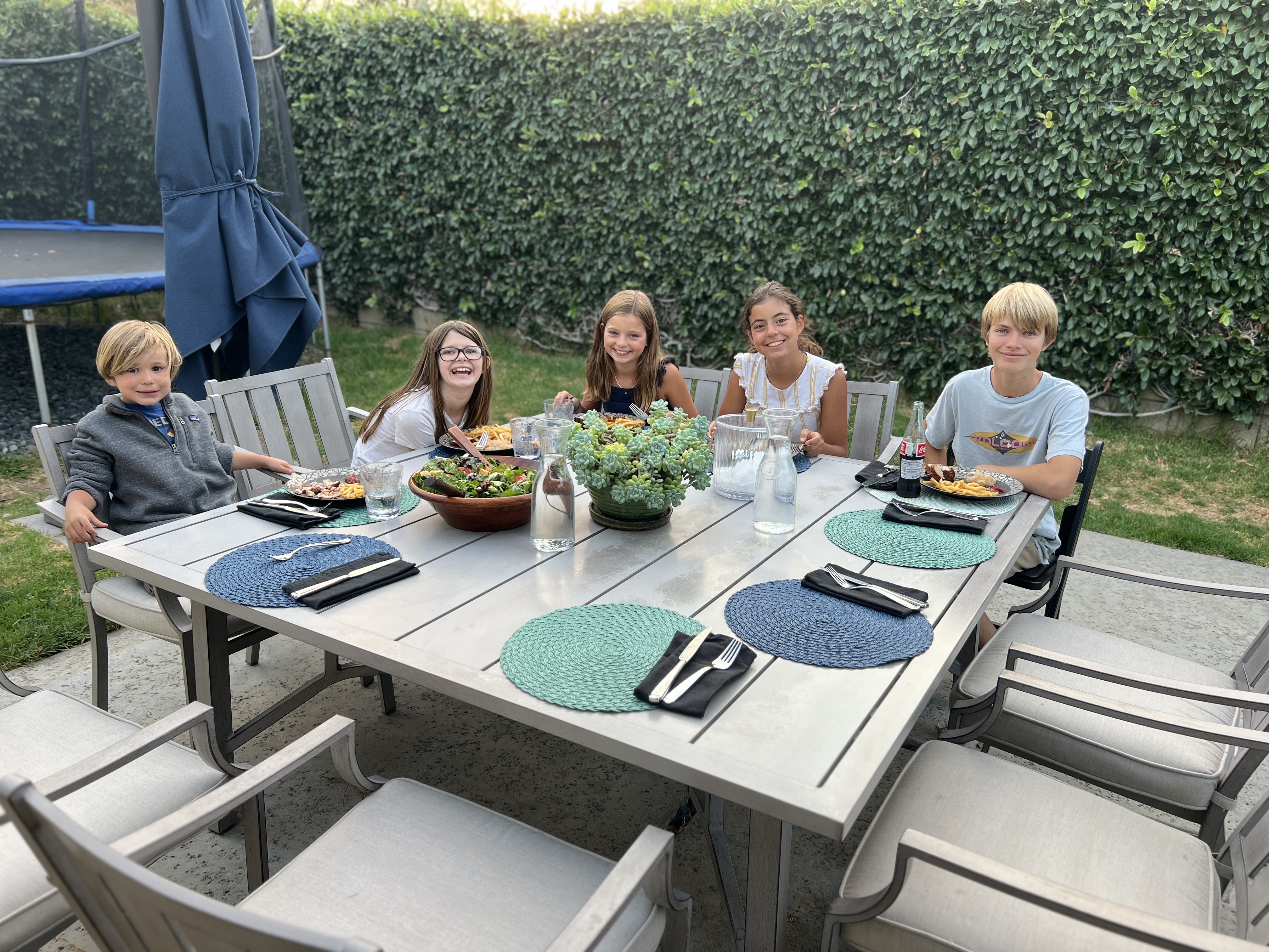 Img: table, tabletop, dining table, people, person, cup, child, female, girl, chair