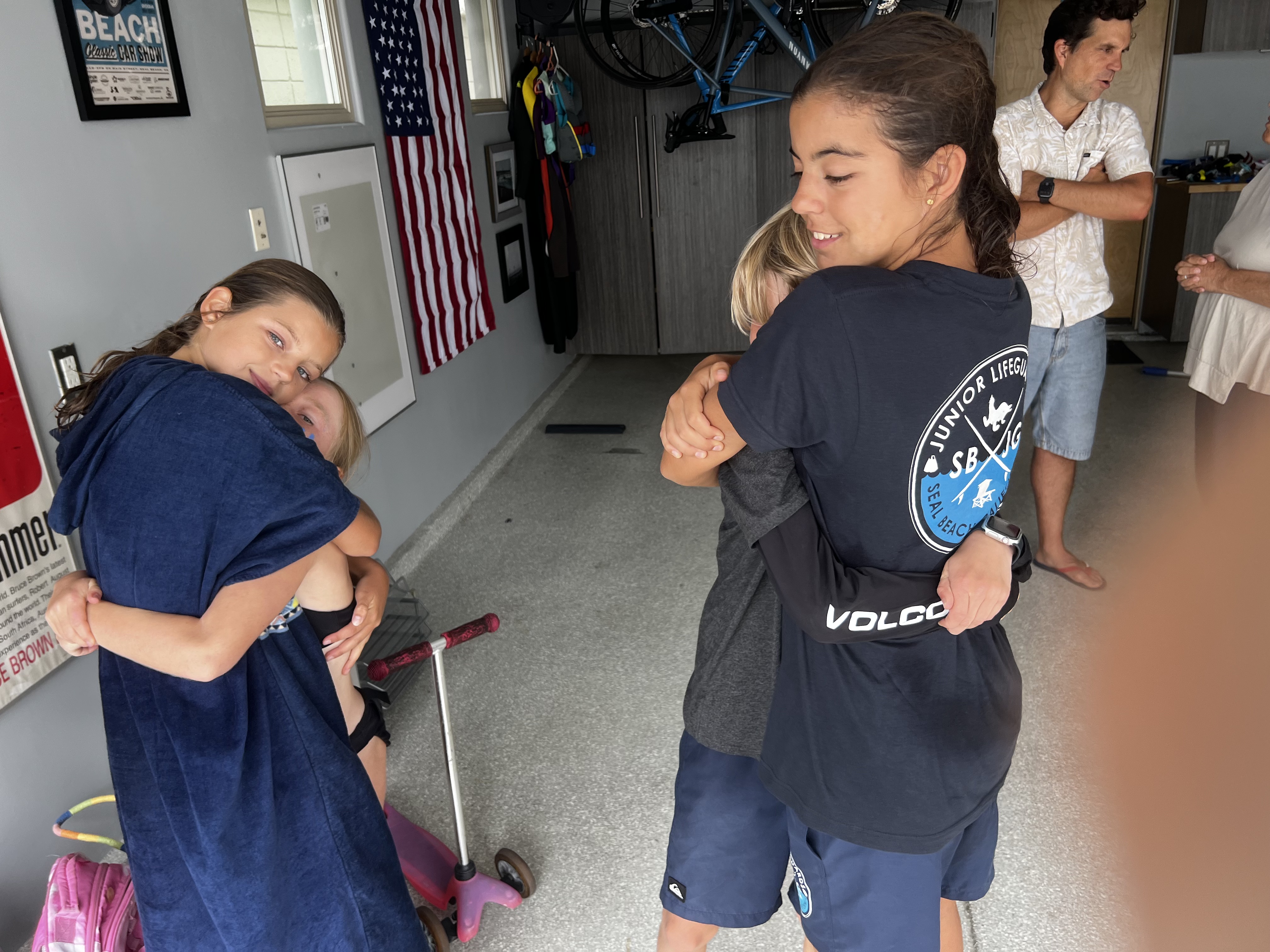 Img: person, adult, female, woman, handbag, hugging, photo frame, wristwatch, flag, bicycle