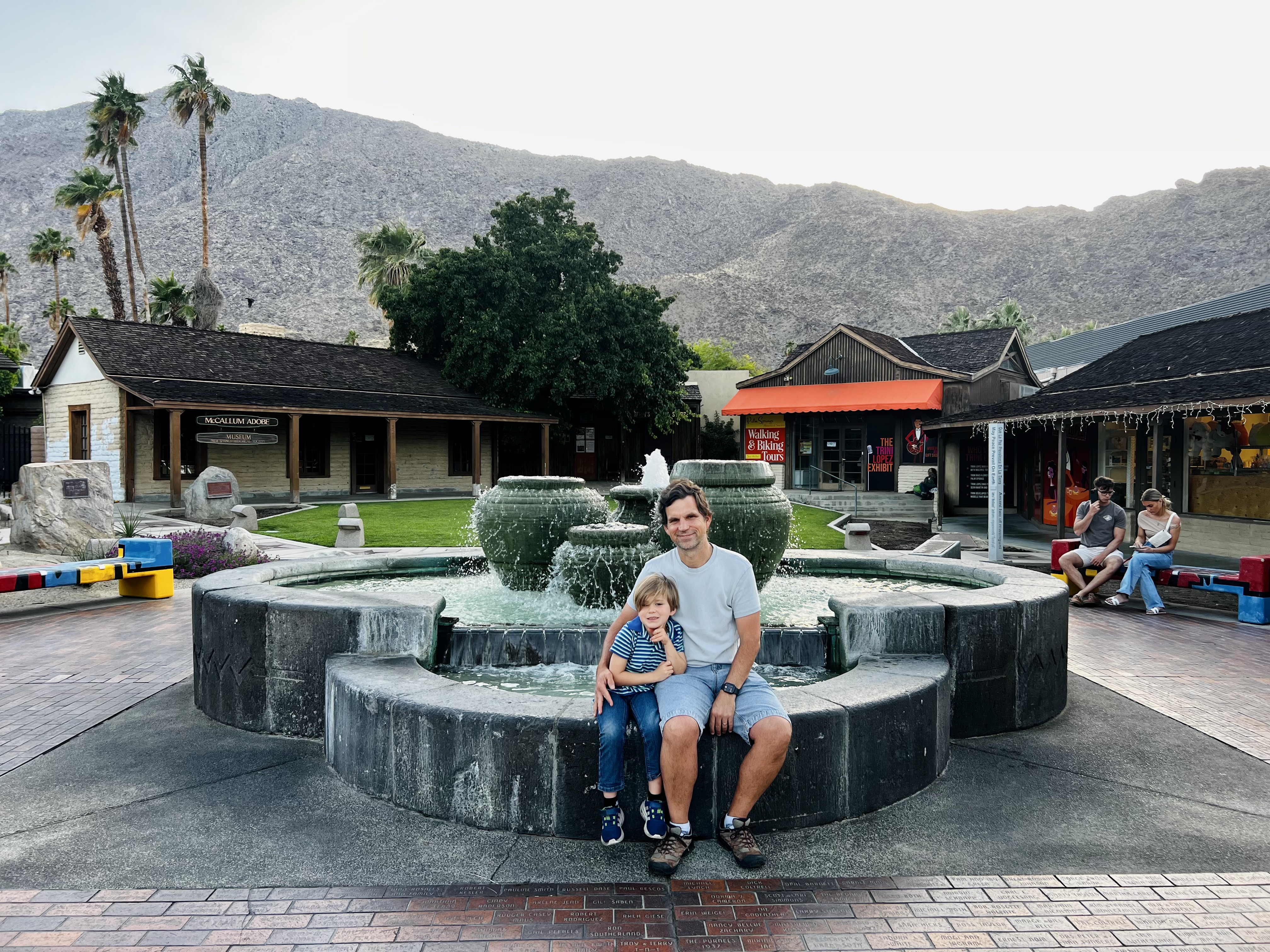 Img: hotel, resort, shoe, adult, male, man, person, portrait, fountain, pants