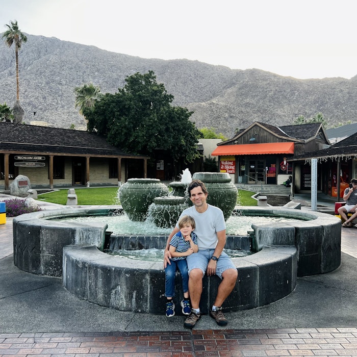 Img: hotel, resort, shoe, adult, male, man, person, portrait, fountain, pants